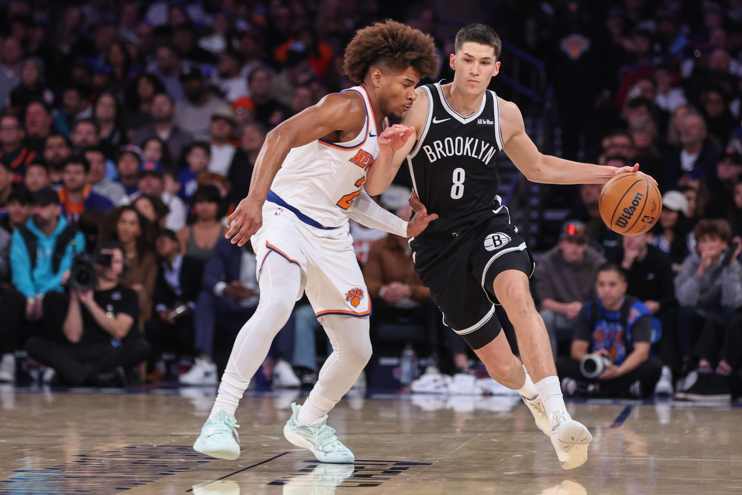 Nov 9, 2025; New York, New York, USA;  Brooklyn Nets guard Egor Demin (8) looks to drive past New York Knicks guard Miles McBride (2) in the fourth quarter at Madison Square Garden. Mandatory Credit: Wendell Cruz-Imagn Images