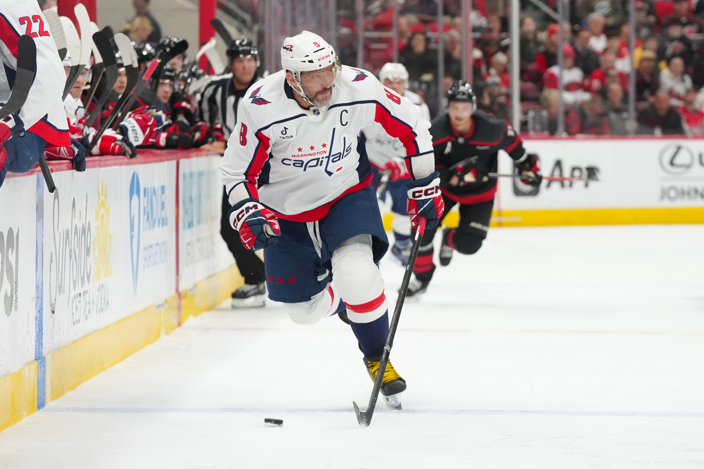 Nov 11, 2025; Raleigh, North Carolina, USA;  Washington Capitals left wing Alex Ovechkin (8) skates with the puck against the Carolina Hurricanes during the second period at Lenovo Center. Mandatory Credit: James Guillory-Imagn Images