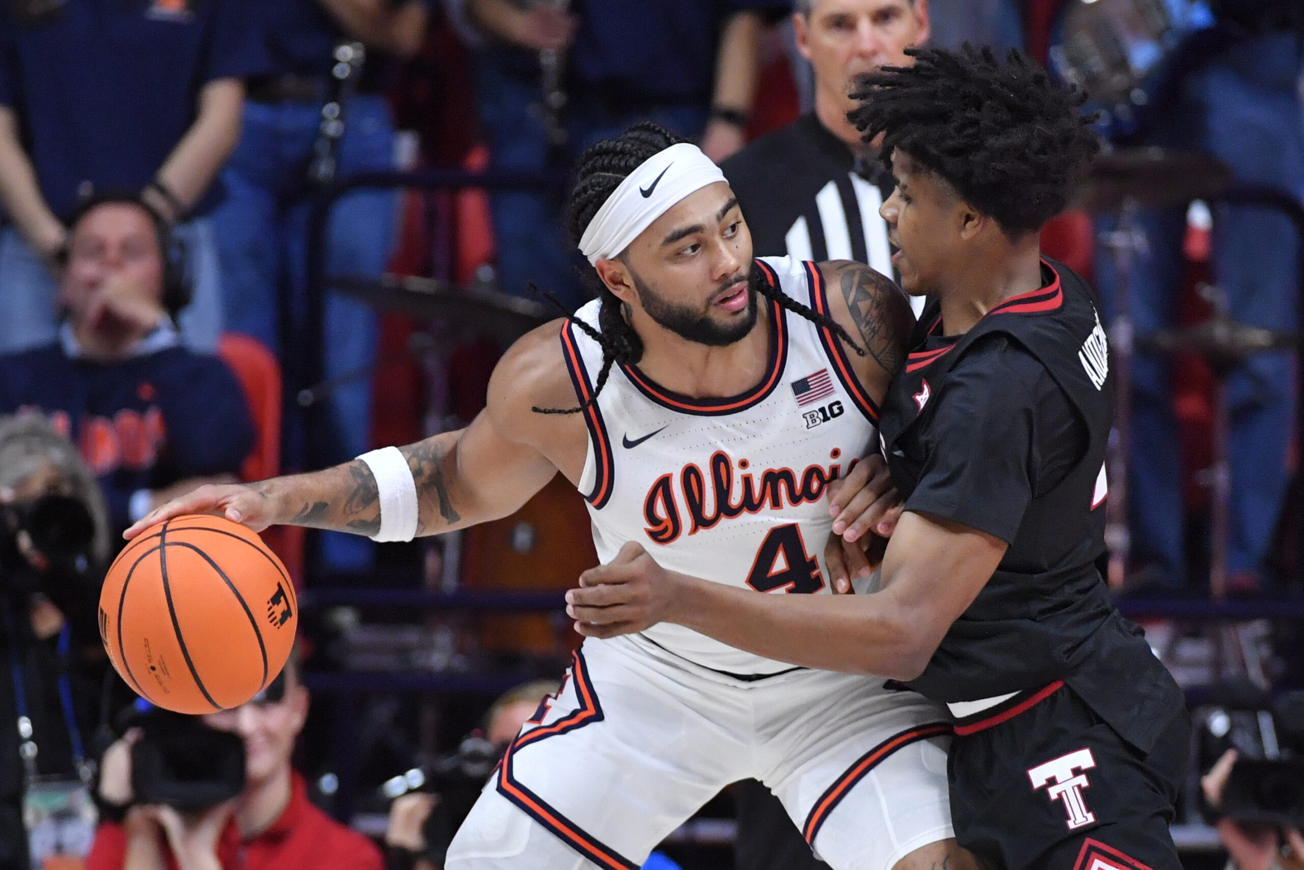 Nov 11, 2025; Champaign, Illinois, USA; Texas Tech Red Raiders guard Christian Anderson (4) defends against Illinois Fighting Illini guard Kylan Boswell (4) during the second half at State Farm Center. Mandatory Credit: Ron Johnson-Imagn Images