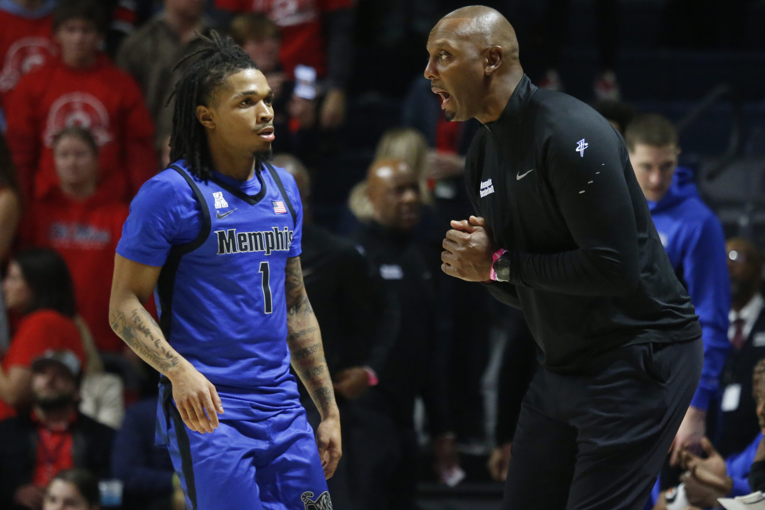Nov 11, 2025; Oxford, Mississippi, USA; Memphis Tigers head coach Penny Hardaway talks with Memphis Tigers guard Dug McDaniel (1) during the second half against the Mississippi Rebels at The Sandy and John Black Pavilion at Ole Miss. Mandatory Credit: Petre Thomas-Imagn Images