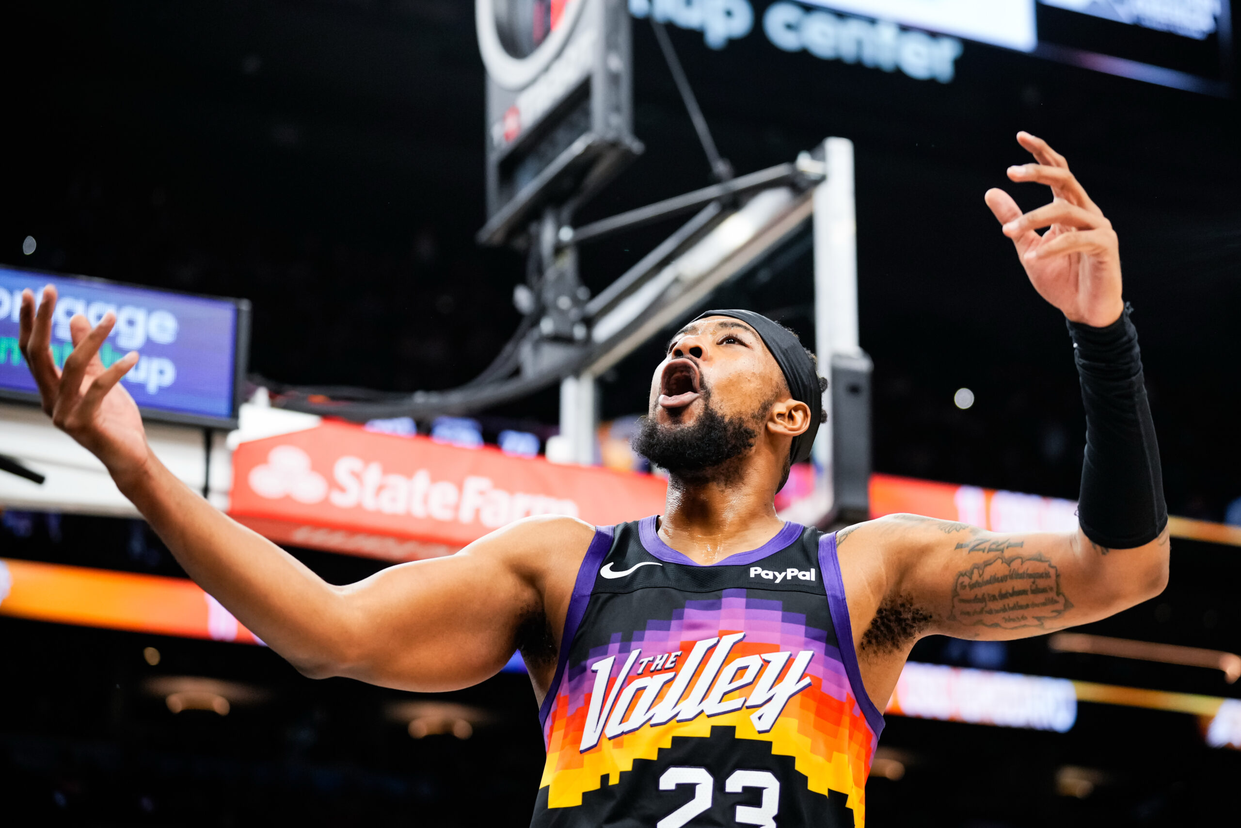 Nov 13, 2025; Phoenix, Arizona, USA;  Phoenix Suns guard Jordan Goodwin (23) hypes up the crowd during the second half of the game at Mortgage Matchup Center. Mandatory Credit: Arianna Grainey-Imagn Images