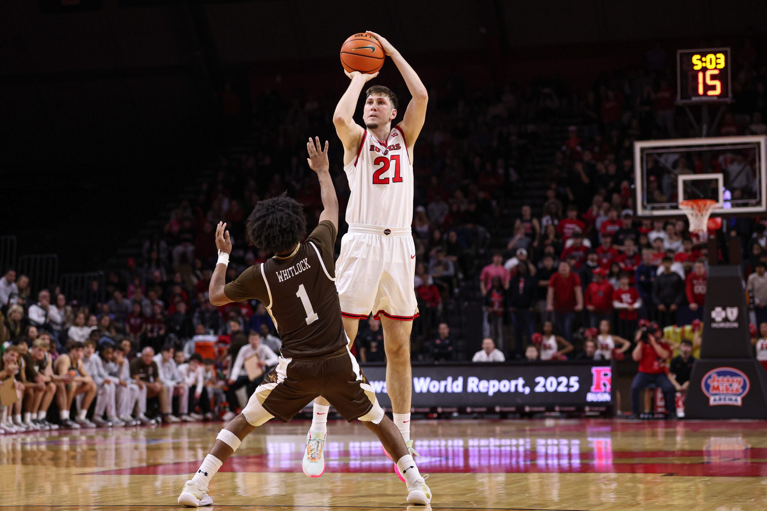 Nov 14, 2025; Piscataway, New Jersey, USA; Rutgers Scarlet Knights center Emmanuel Ogbole (21) shoots the ball as Lehigh Mountain Hawks guard Nasir Whitlock (1) defends during the second half at Jersey Mike's Arena. Mandatory Credit: Vincent Carchietta-Imagn Images