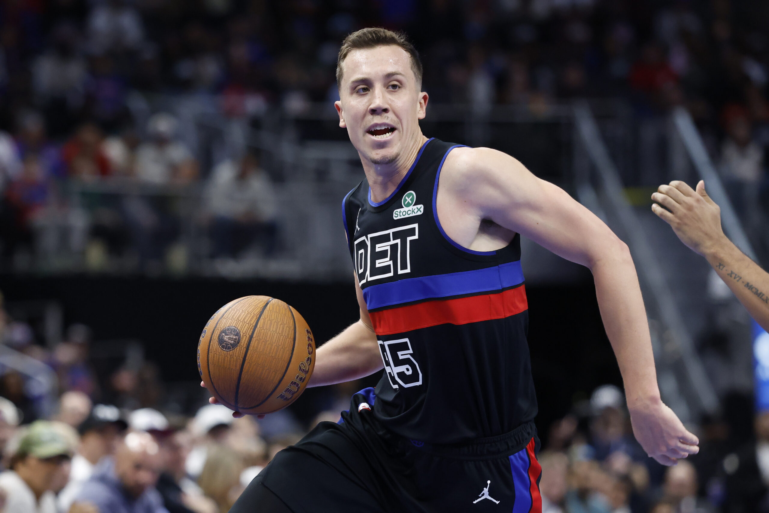 Nov 14, 2025; Detroit, Michigan, USA;  Detroit Pistons forward Duncan Robinson (55) dribbles in the second half against the Philadelphia 76ers at Little Caesars Arena. Mandatory Credit: Rick Osentoski-Imagn Images