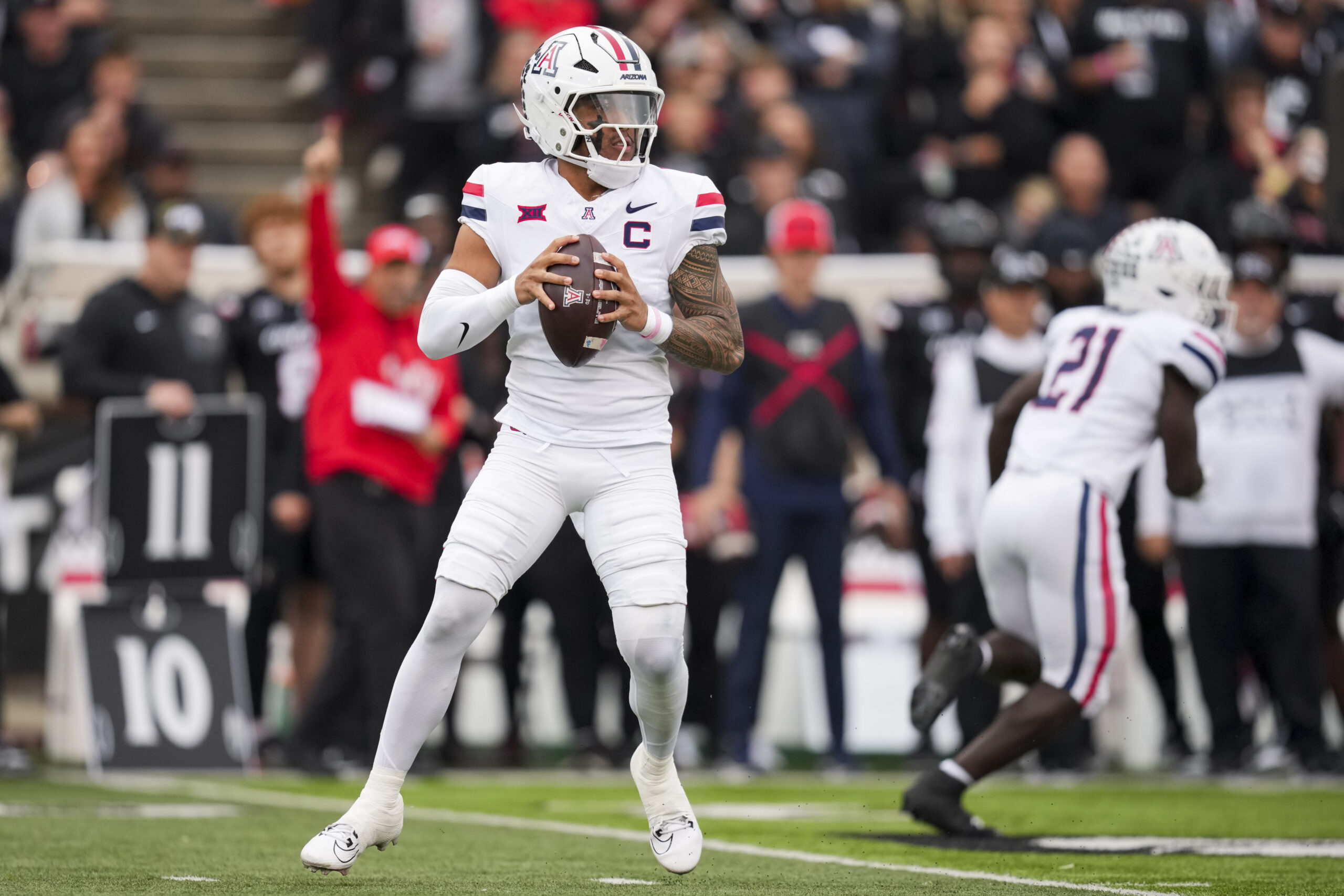 Nov 15, 2025; Cincinnati, Ohio, USA;  Arizona Wildcats quarterback Noah Fifita (1) drops back to pass against the Cincinnati Bearcats in the first half at Nippert Stadium. Mandatory Credit: Aaron Doster-Imagn Images