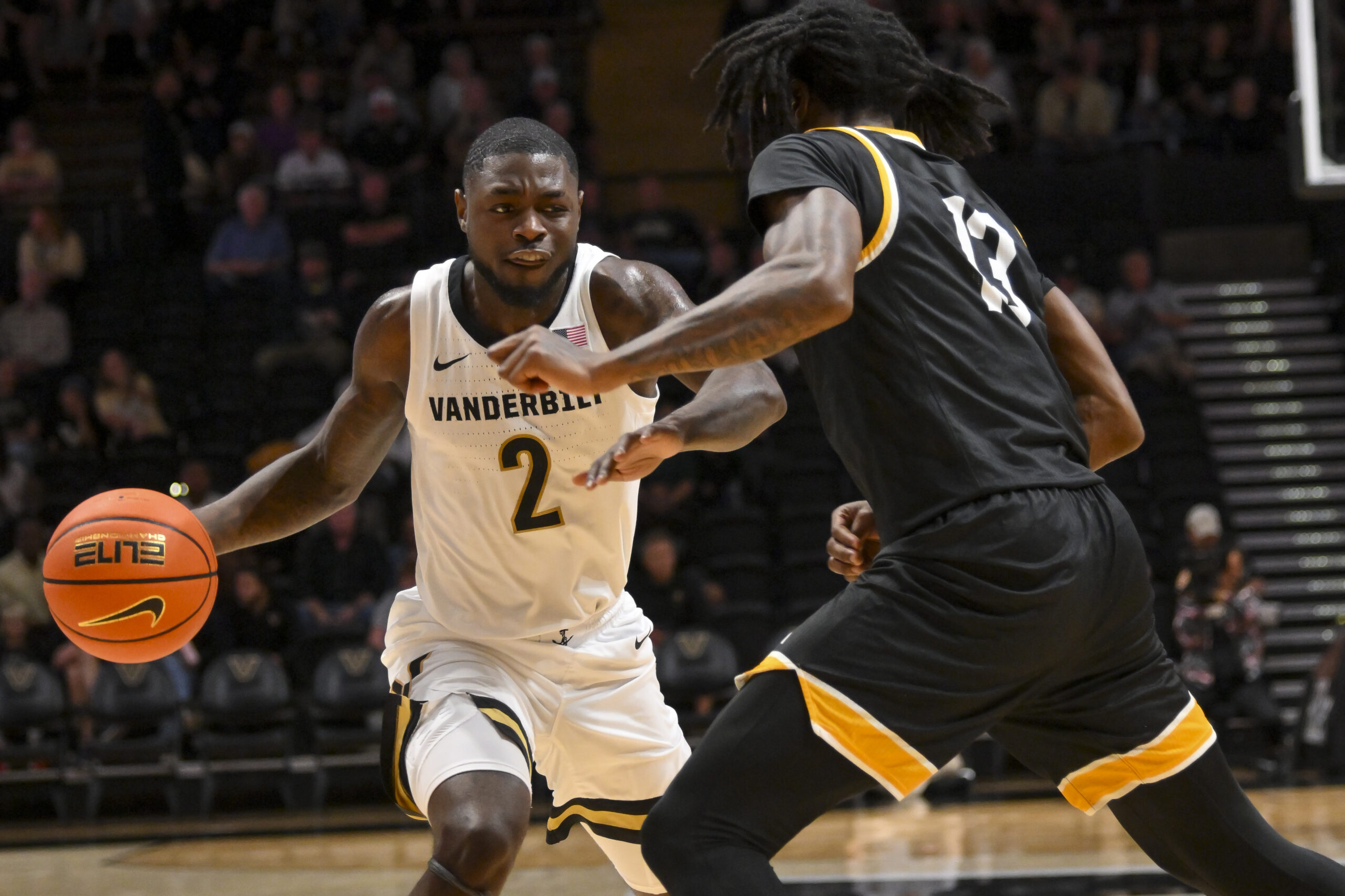 Nov 15, 2025; Nashville, Tennessee, USA;  Vanderbilt Commodores guard Duke Miles (2) drives to the basket past Arkansas-Pine Bluff Golden Lions guard Quion Williams (13) during the first half at Memorial Gymnasium. Mandatory Credit: Steve Roberts-Imagn Images