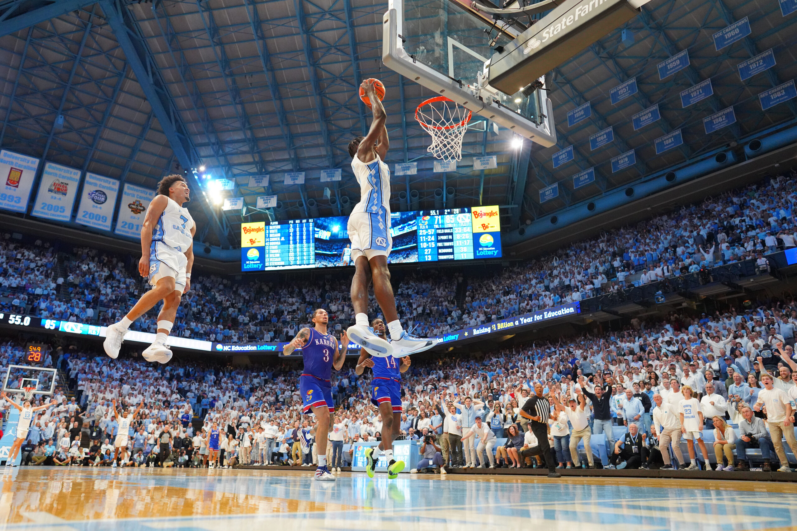 Nov 7, 2025; Chapel Hill, North Carolina, USA; North Carolina Tar Heels forward Caleb Wilson (8) dunks the ball as guard Seth Trimble (7) jumps in the background near the end of the second half at Dean E. Smith Center. Mandatory Credit: Bob Donnan-Imagn Images
