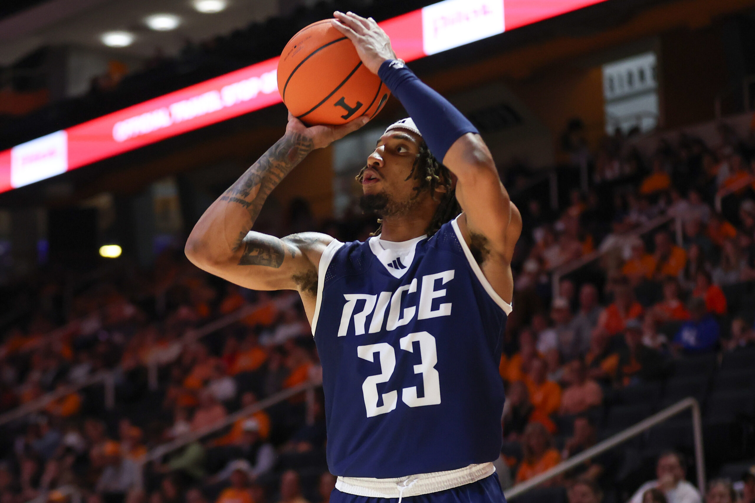 Nov 17, 2025; Knoxville, Tennessee, USA;  Rice Owls guard Nick Anderson (23) shoots a three point basket during the second half against the Tennessee Volunteers at Thompson-Boling Arena at Food City Center. Mandatory Credit: Randy Sartin-Imagn Images