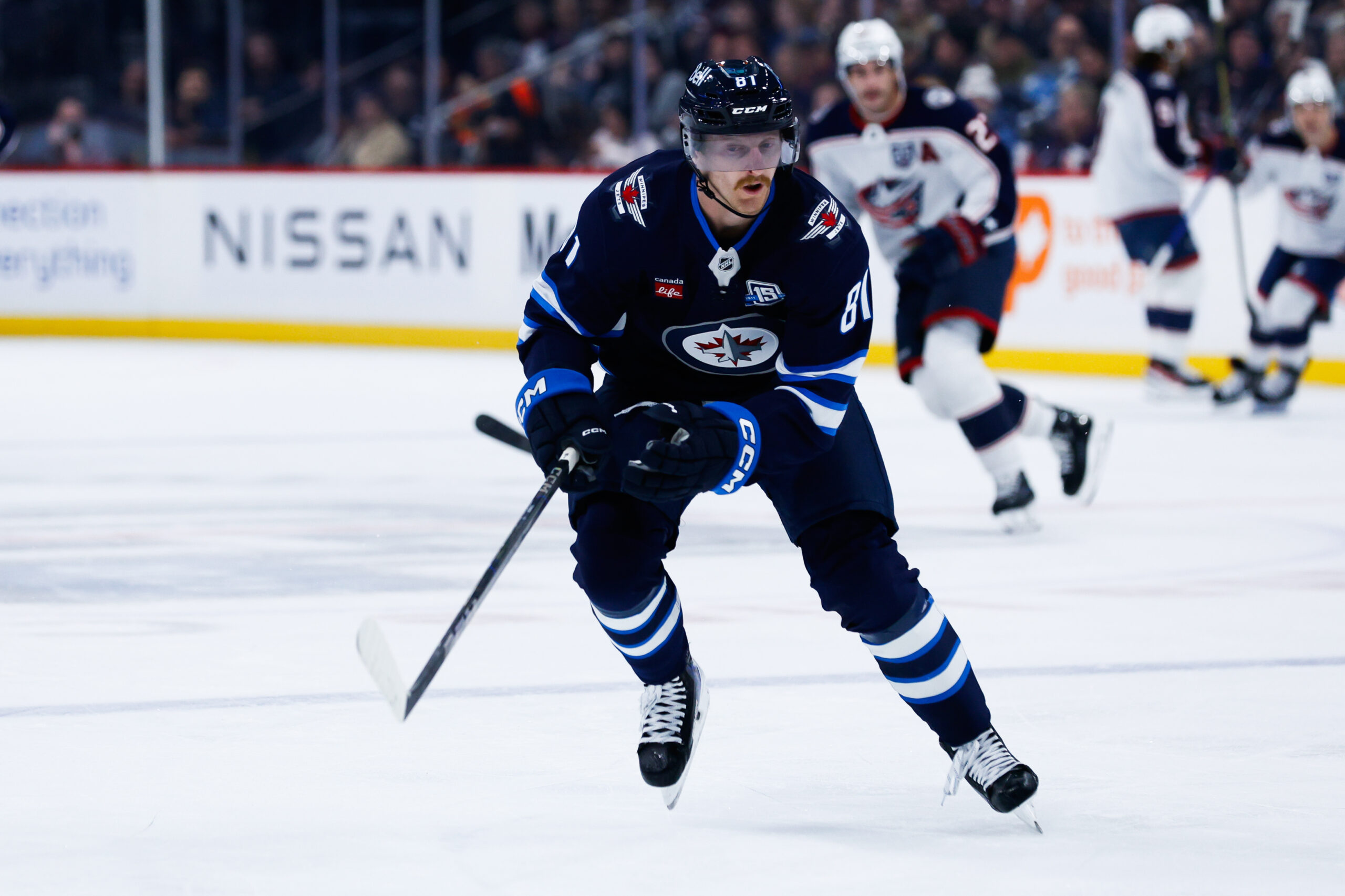 Nov 18, 2025; Winnipeg, Manitoba, CAN;  Winnipeg Jets forward Kyle Connor (81) skies after the puck in the Colorado Avalanche zone during the first period at Canada Life Centre. Mandatory Credit: Terrence Lee-Imagn Images