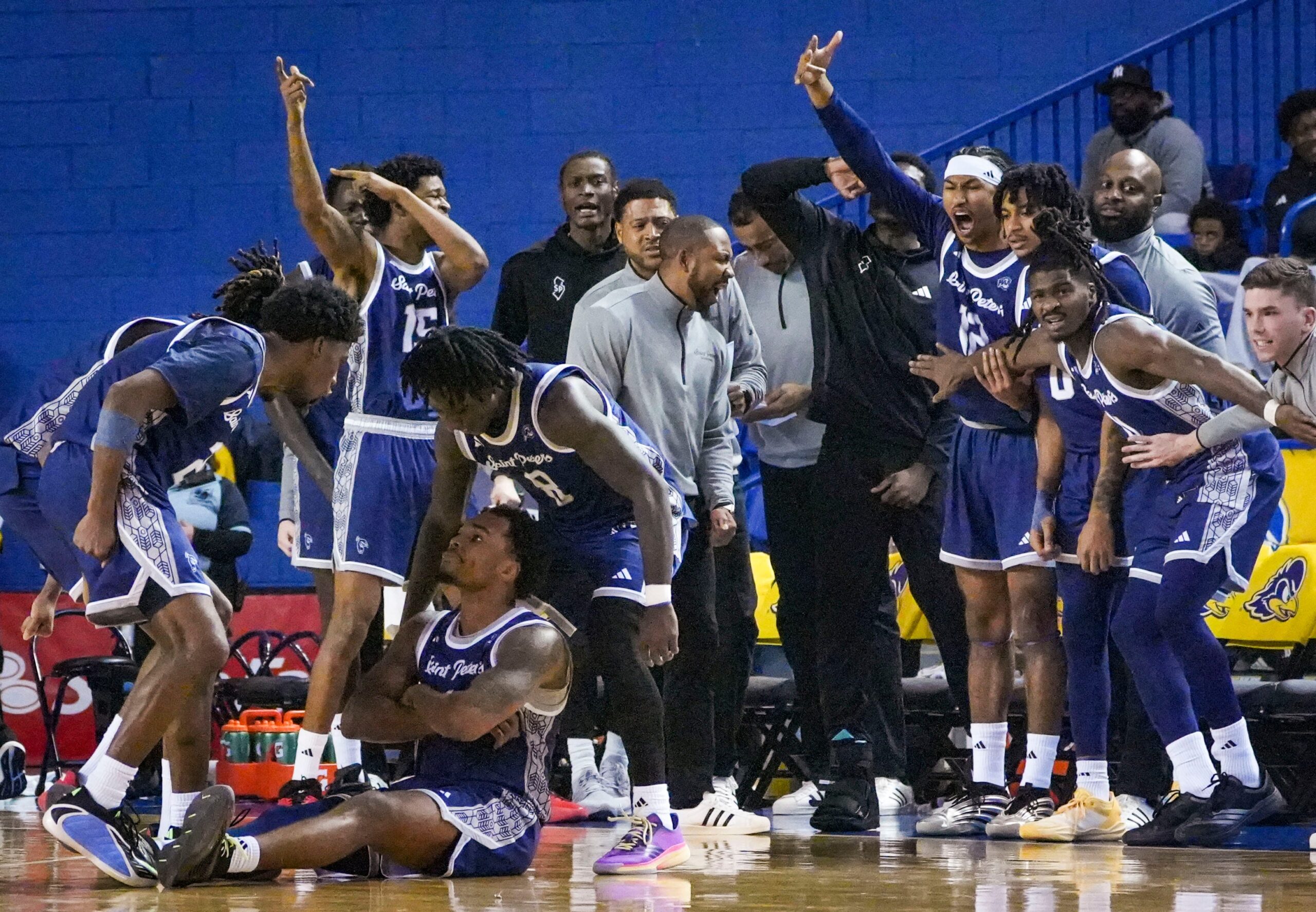 Saint Peter’s Brent Bland (seated) reacts after hitting a shot as he was fouled In the second half of the Blue Hens’ 81-70 win at the Bob Carpenter Center, Nov. 18, 2025. Saint Peter’s pulled within five late in the second half before Delaware reestablished a double-digit lead.