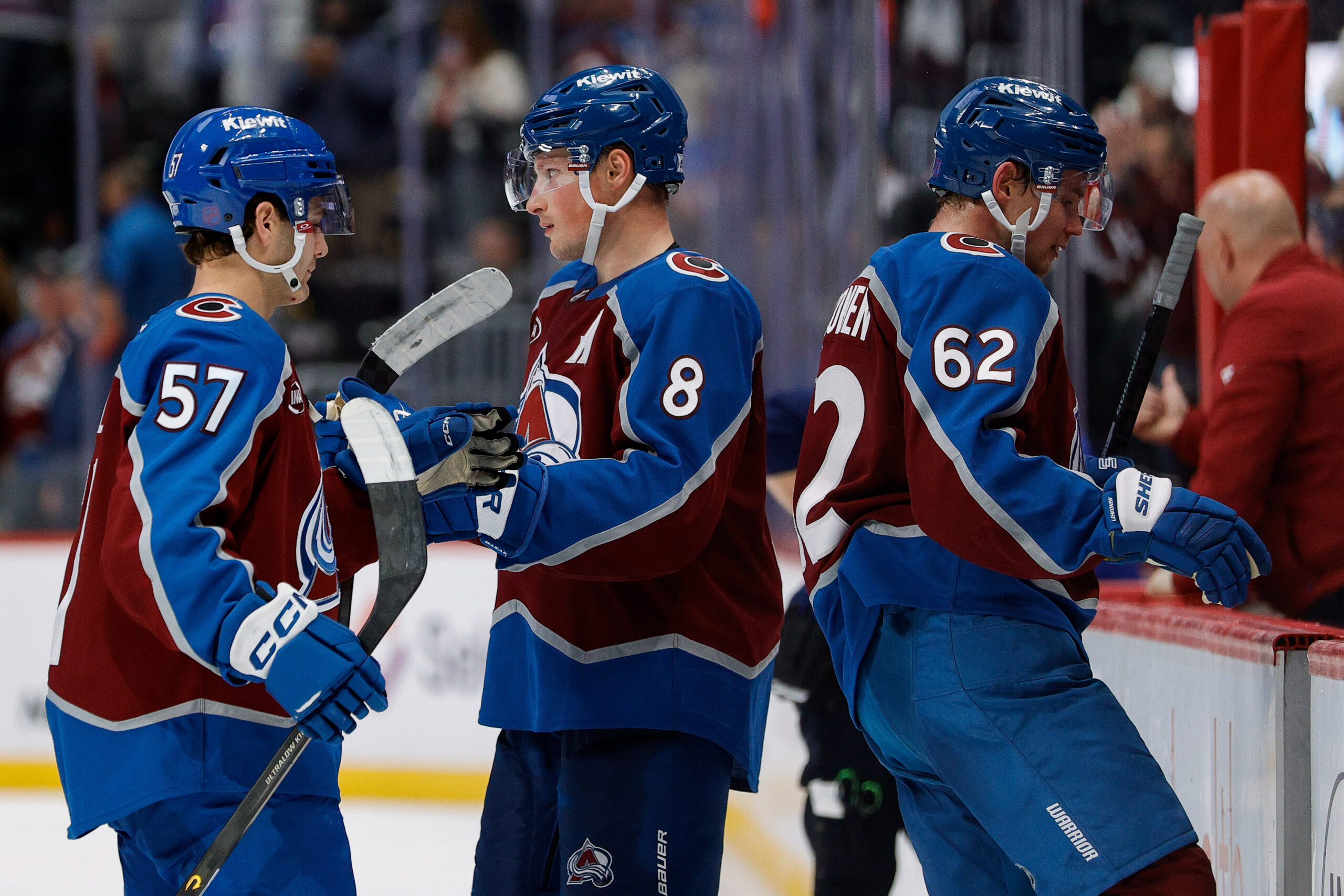 Nov 20, 2025; Denver, Colorado, USA; Colorado Avalanche defenseman Cale Makar (8) with center Tristen Nielsen (57) and left wing Artturi Lehkonen (62) after the game against the New York Rangers at Ball Arena. Mandatory Credit: Isaiah J. Downing-Imagn Images
