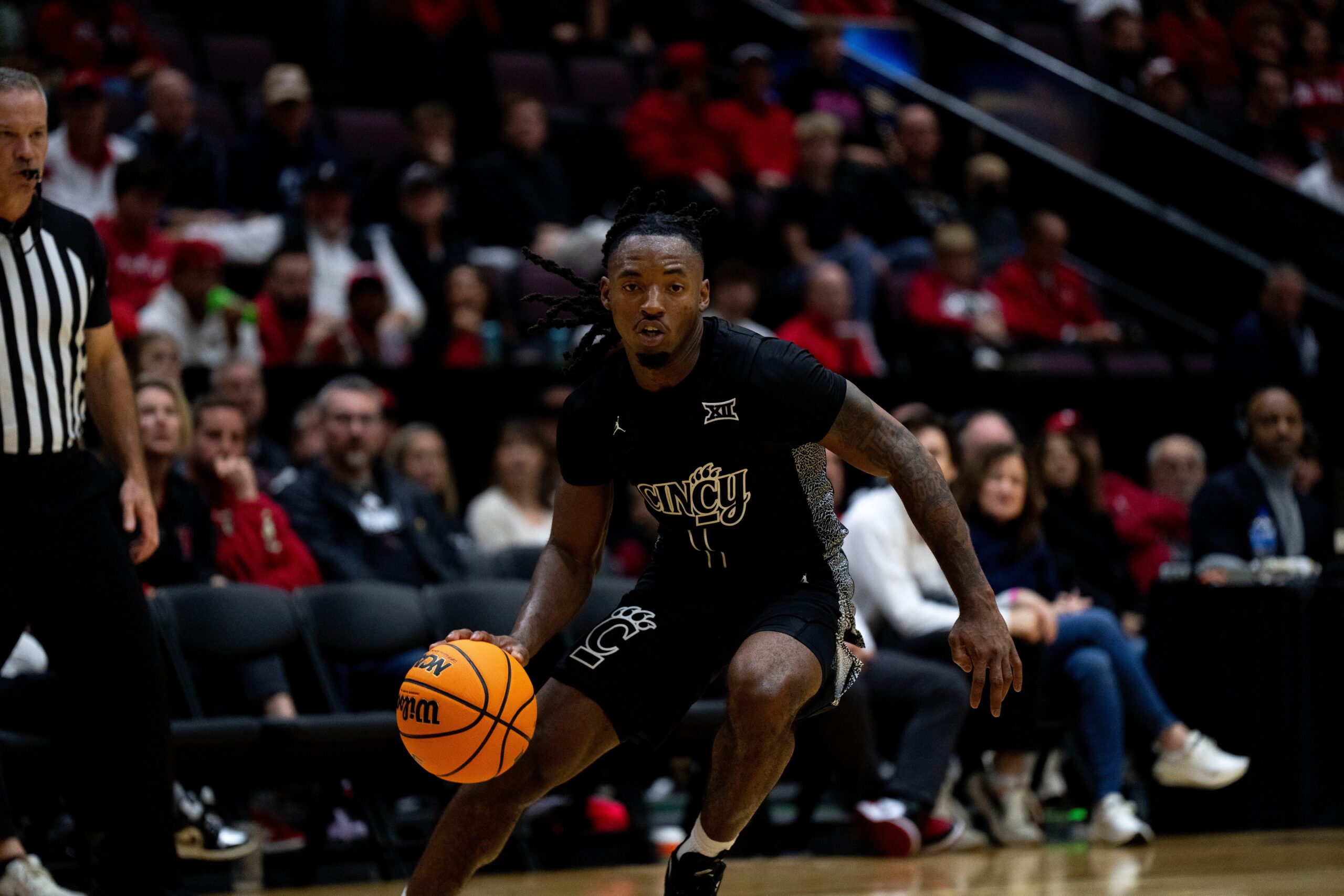 Cincinnati Bearcats guard Day Day Thomas (1) handles the ball in the second half of the NCAA Basketball game at Heritage Bank Center in Cincinnati on Nov. 21, 2025.