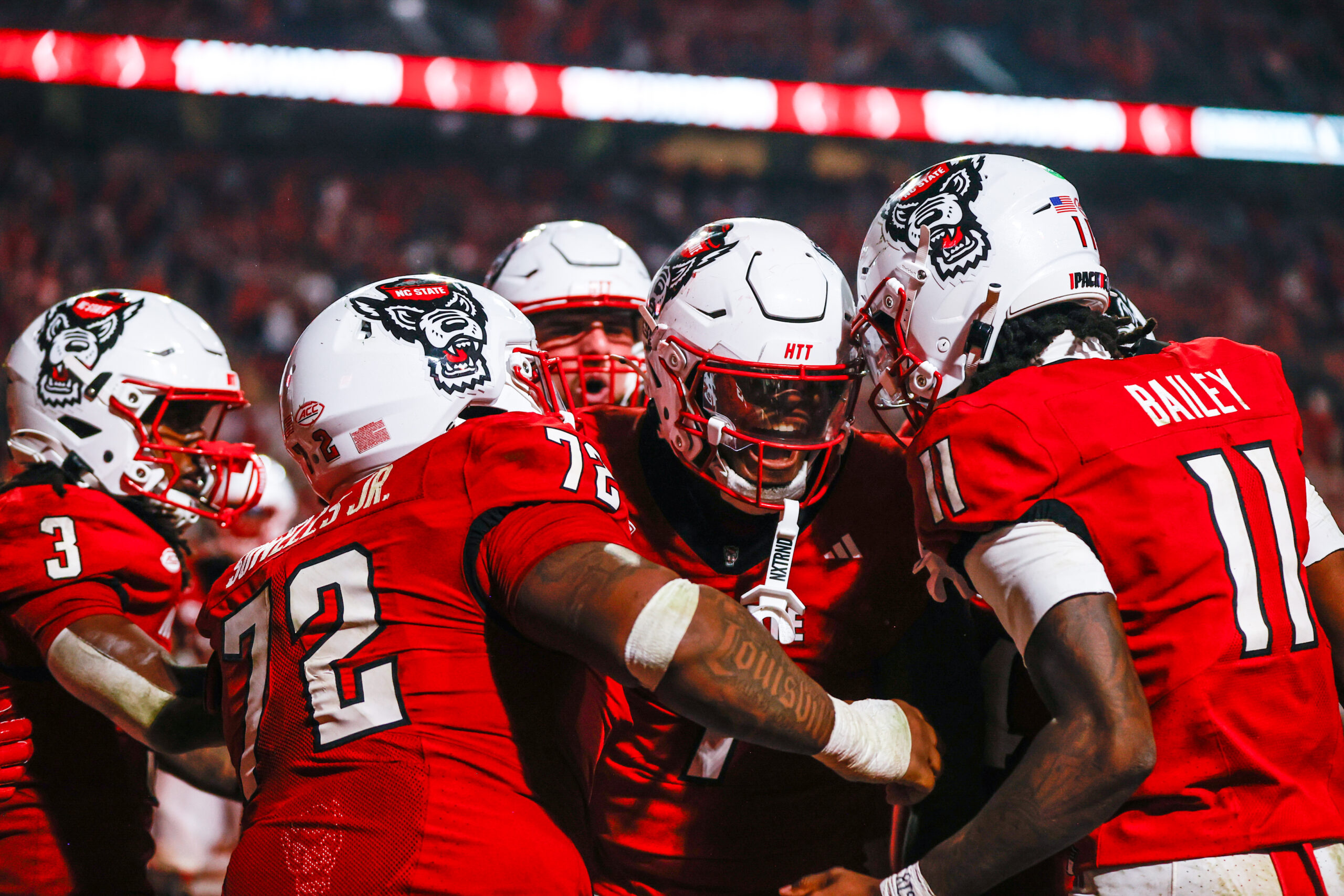 Nov 21, 2025; Raleigh, North Carolina, USA;  NC State Wolfpack tight end Justin Joly (7) celebrates his touchdown to win the game during the second half of the game against Florida State Seminoles at Carter-Finley Stadium. Mandatory Credit: Jaylynn Nash-Imagn Images