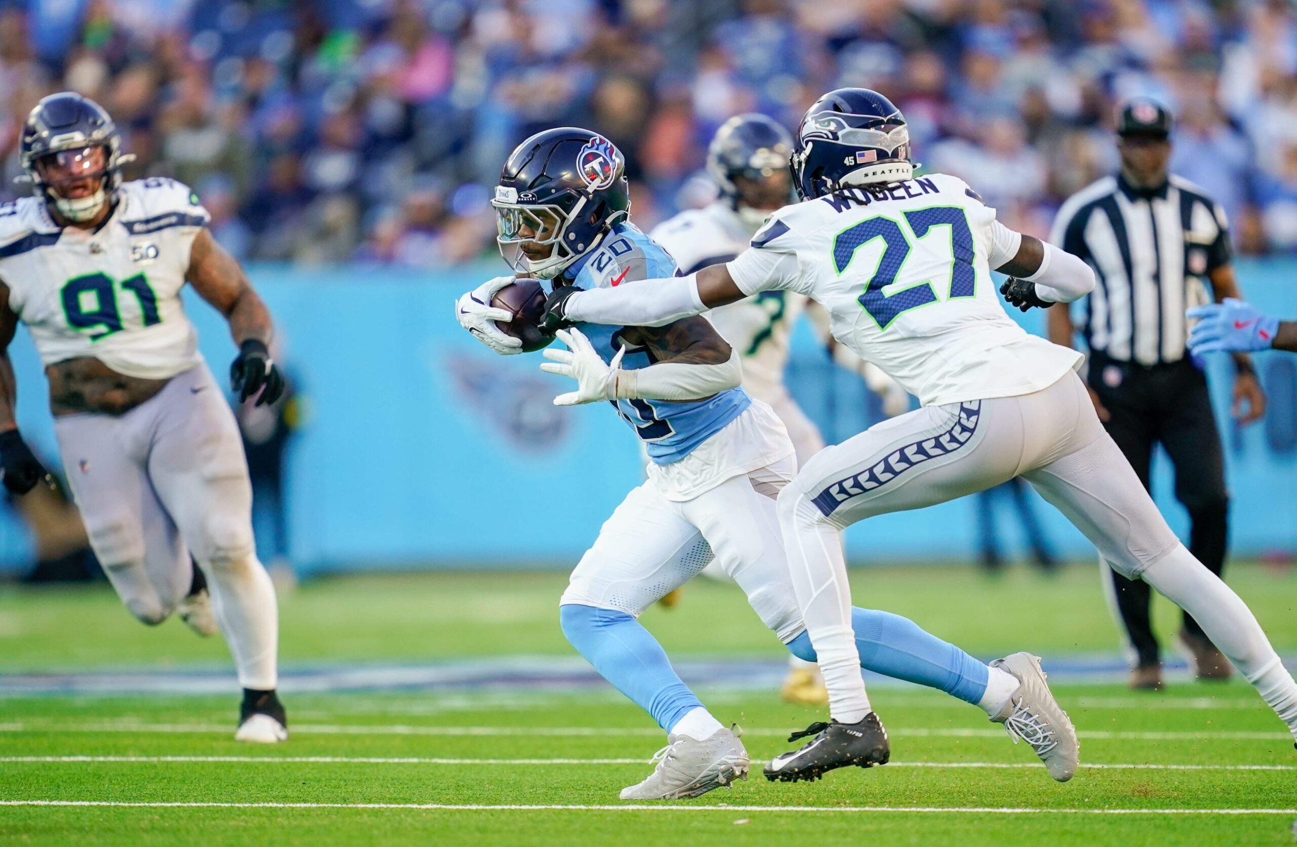 Nov 23, 2025; Nashville, Tennessee, USA; Tennessee Titans running back Tony Pollard (20) runs the ball during the fourth quarter against the Seattle Seahawks  at Nissan Stadium. Mandatory Credit: Andrew Nelles-USA TODAY Network via Imagn Images