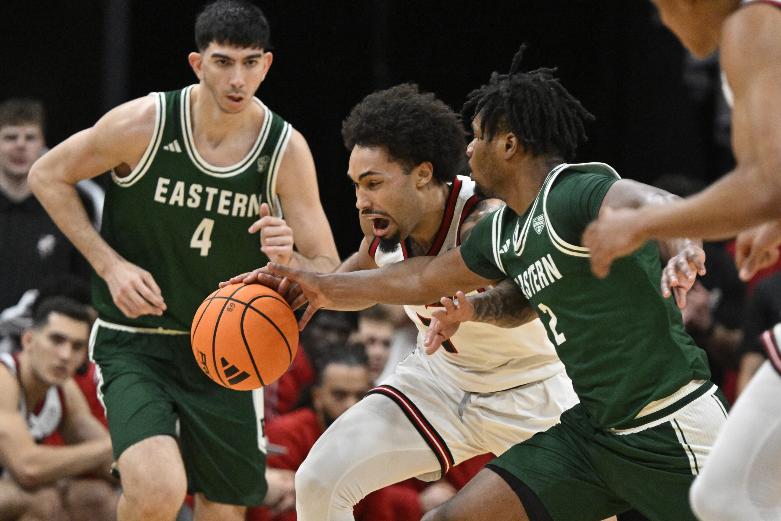 Nov 24, 2025; Louisville, Kentucky, USA; (Editors Notes: Caption Correction) Louisville Cardinals guard J'Vonne Hadley (1) dribbles against Eastern Michigan Eagles guard Carlos Hart (2) during the first half at KFC Yum! Center. Mandatory Credit: Jamie Rhodes-Imagn Images