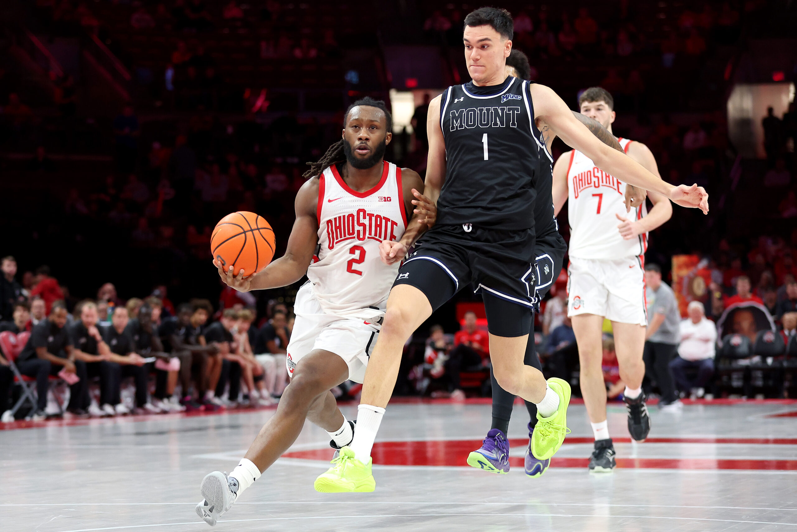 Nov 25, 2025; Columbus, Ohio, USA; Ohio State Buckeyes guard Bruce Thornton (2) looks to pass the ball as Mount St. Mary's Mountaineers forward Anastasios Rozakeas (1) defends during the second half at Value City Arena. Mandatory Credit: Joseph Maiorana-Imagn Images