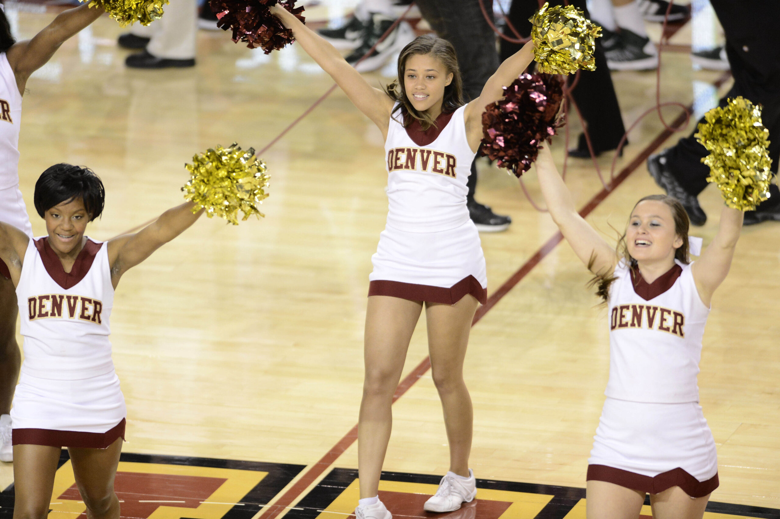 Nov 21, 2012; Denver, CO, USA;  Denver Pioneers cheerleaders perform following the game against the Colorado State Rams at Magness Arena. The Rams defeated the Pioneers 60-53. Mandatory Credit: Ron Chenoy-Imagn Images