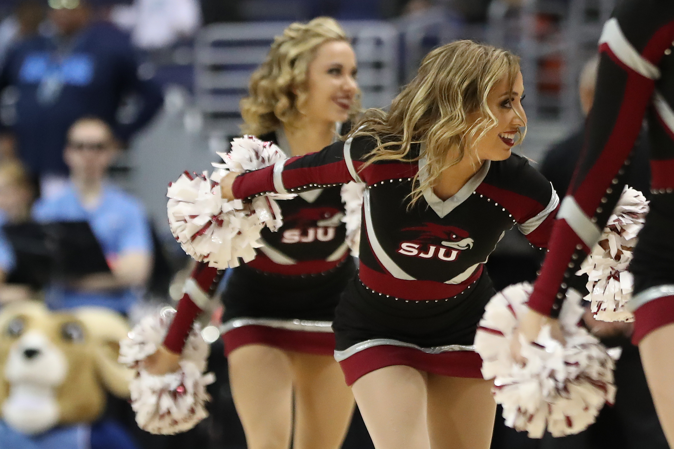 Mar 10, 2018; Washington, DC, USA; Saint Joseph's Hawks cheerleaders dance on the court during a timeout against the Rhode Island Rams in the first half in an Atlantic 10 conference tournament semifinal at Capital One Arena. The Rams won 90-87. Mandatory Credit: Geoff Burke-Imagn Images