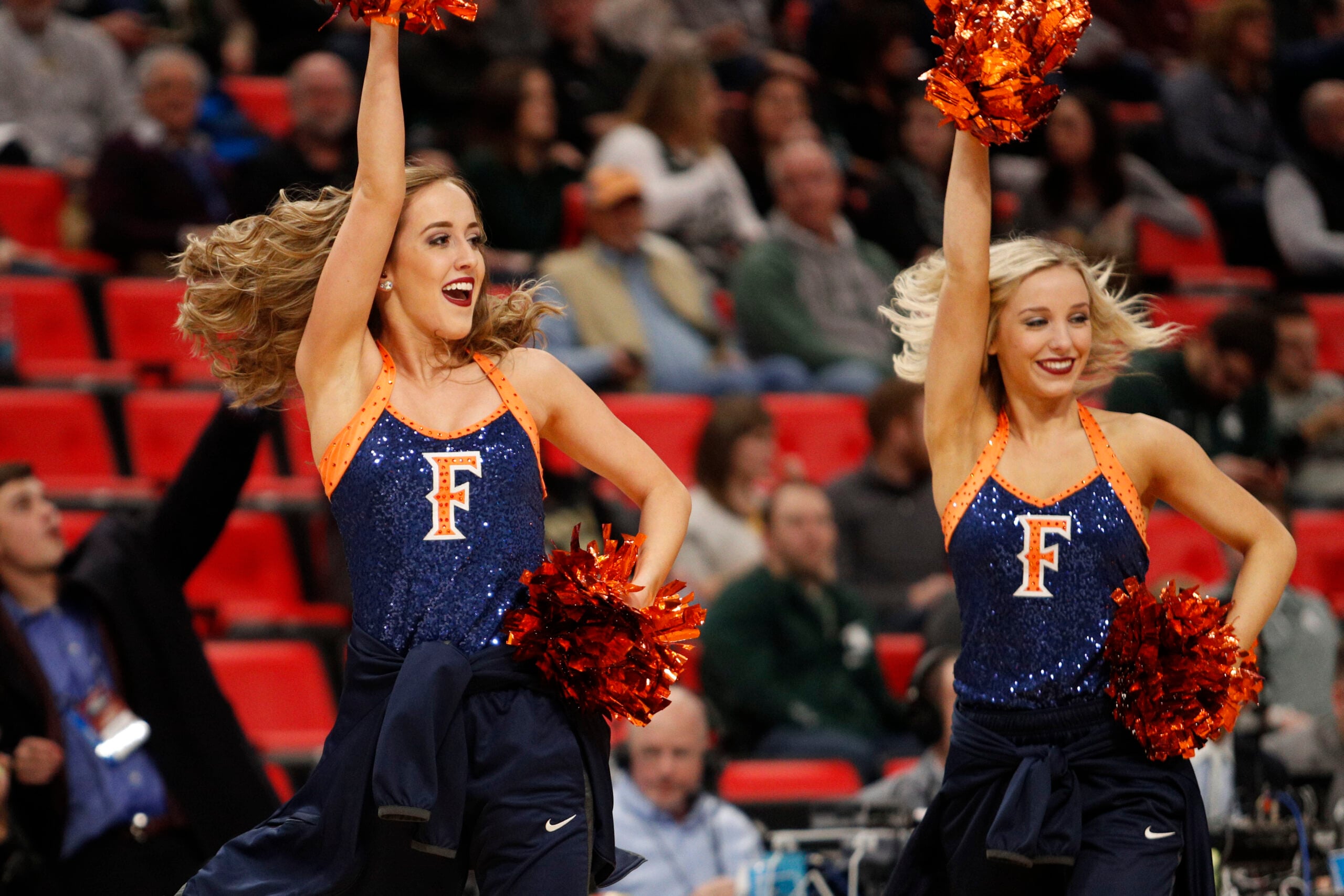 Mar 16, 2018; Detroit, MI, USA; Cal State Fullerton Titans cheerleaders in the first half in the game against the Purdue Boilermakers  in the first round of the 2018 NCAA Tournament at Little Caesars Arena. Mandatory Credit: Raj Mehta-Imagn Images