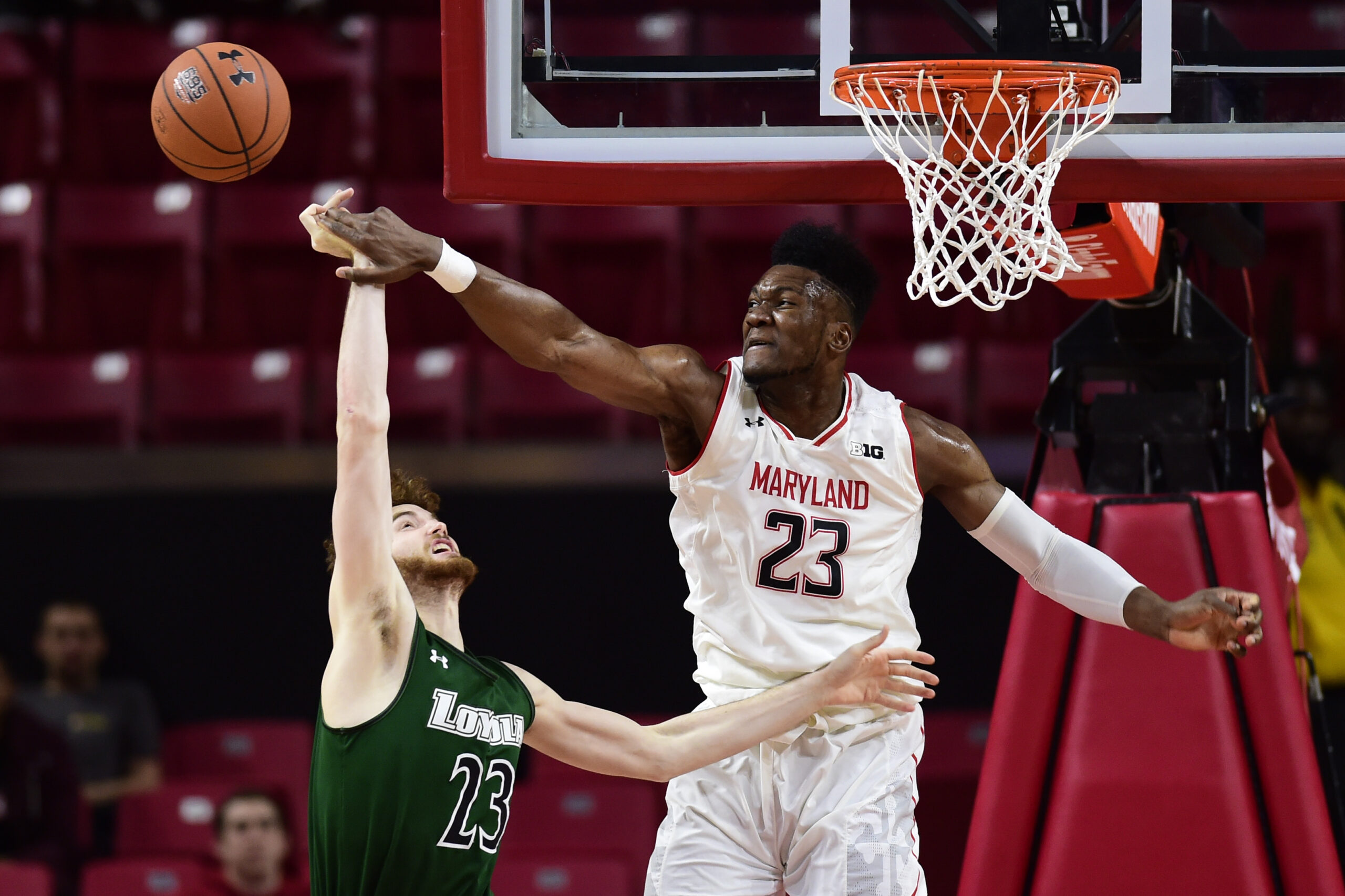 Dec 11, 2018; College Park, MD, USA; Maryland Terrapins forward Bruno Fernando (23) blocks Loyola (Md) Greyhounds forward Brent Holcombe (23) shot during the second half at XFINITY Center. Mandatory Credit: Tommy Gilligan-Imagn Images