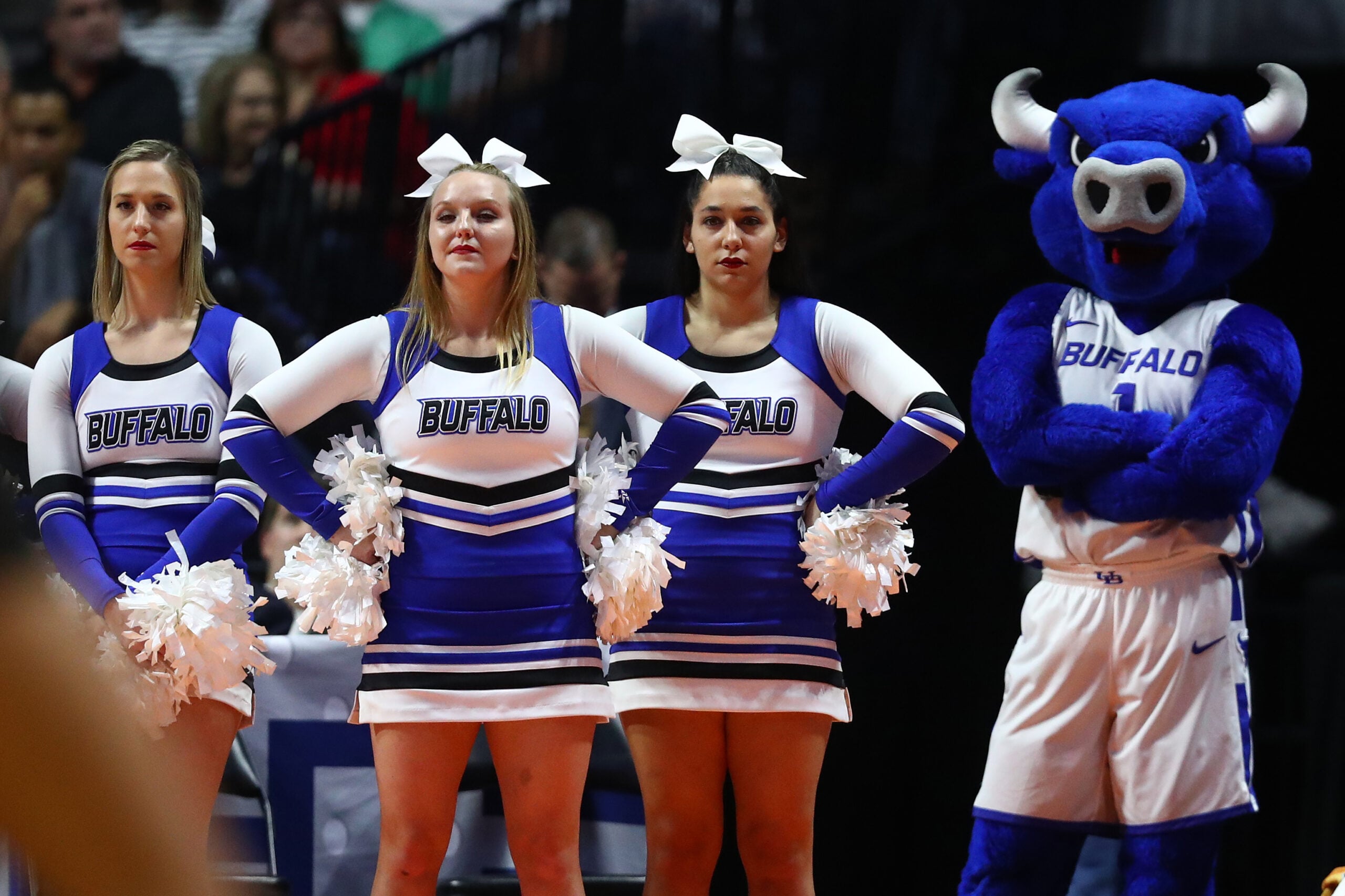 Mar 24, 2019; Tulsa, OK, USA; Buffalo Bulls mascot and cheerleaders watch the Texas Tech Red Raiders cheerleaders preform on the court during a stoppage in play in the first half in the second round of the 2019 NCAA Tournament at BOK Center. Mandatory Credit: Mark J. Rebilas-Imagn Images