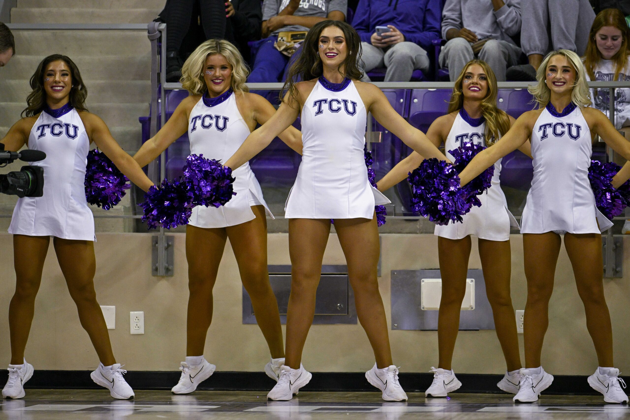 Nov 7, 2022; Fort Worth, Texas, USA; The TCU Horned Frogs showgirls cheerleader dancers perform during the game between the TCU Horned Frogs and the Arkansas-Pine Bluff Golden Lions at Ed and Rae Schollmaier Arena. Mandatory Credit: Jerome Miron-Imagn Images