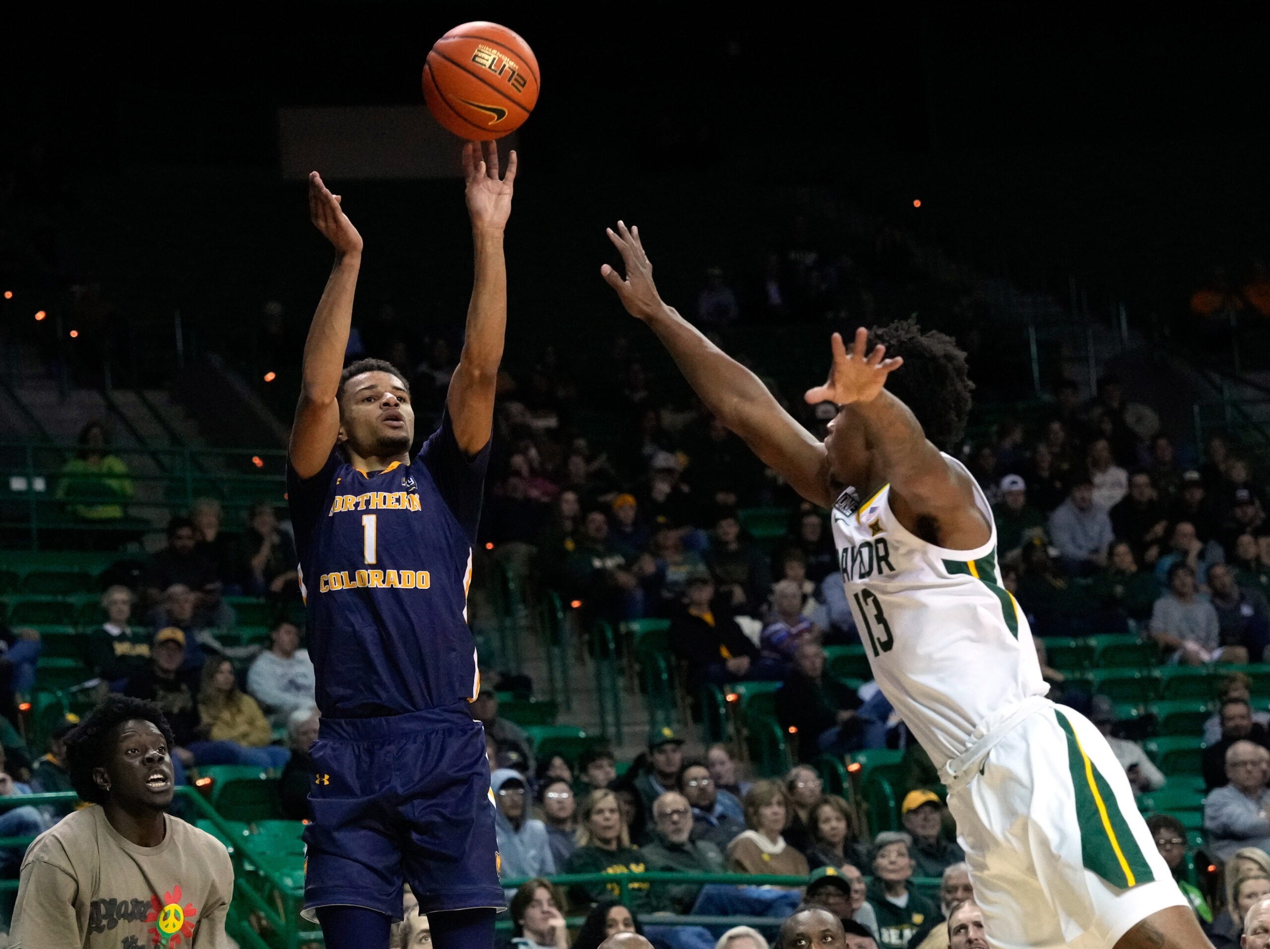 Nov 14, 2022; Waco, Texas, USA;  Northern Colorado Bears guard Daylen Kountz (1) shoots against Baylor Bears guard Langston Love (13) during the first half at Ferrell Center. Mandatory Credit: Chris Jones-Imagn Images