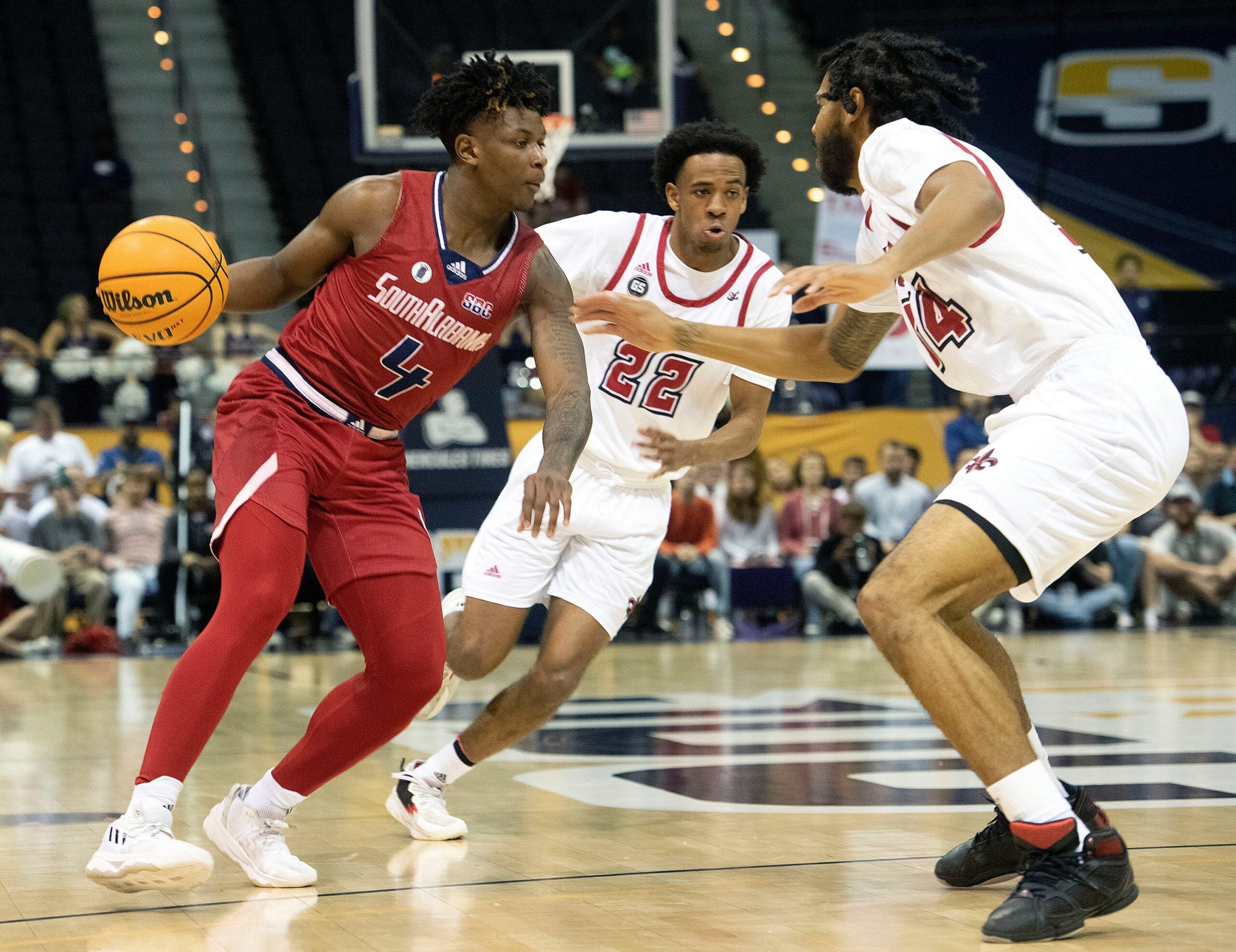 South Alabama's Isaiah Moore (No. 4) splits Louisiana's defense during the SBC Men's Basketball Championship game at the Pensacola Bay Center on Monday, March 6, 2023. The Ragin' Cajuns defeat the Jags 71-66.

Sbc Men S Basketball Usa Vs Louisiana