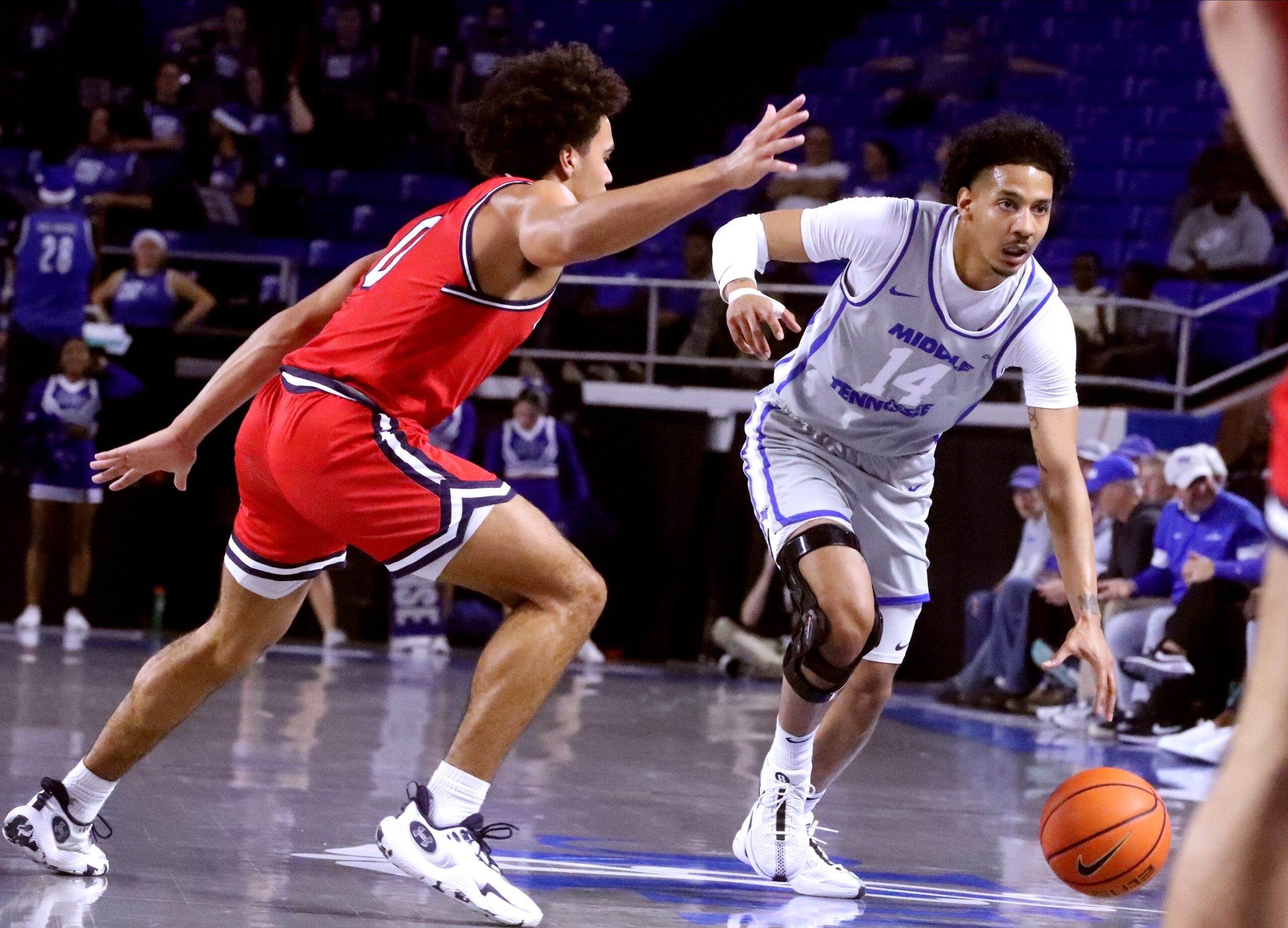 Middle Tennessee guard Jalen Jordan (14) takes the ball down the court as Belmont guard Ja'Kobi Gillespie (0) guards him during the men   s basketball game on Saturday, Dec. 9, 2023, at MTSU..