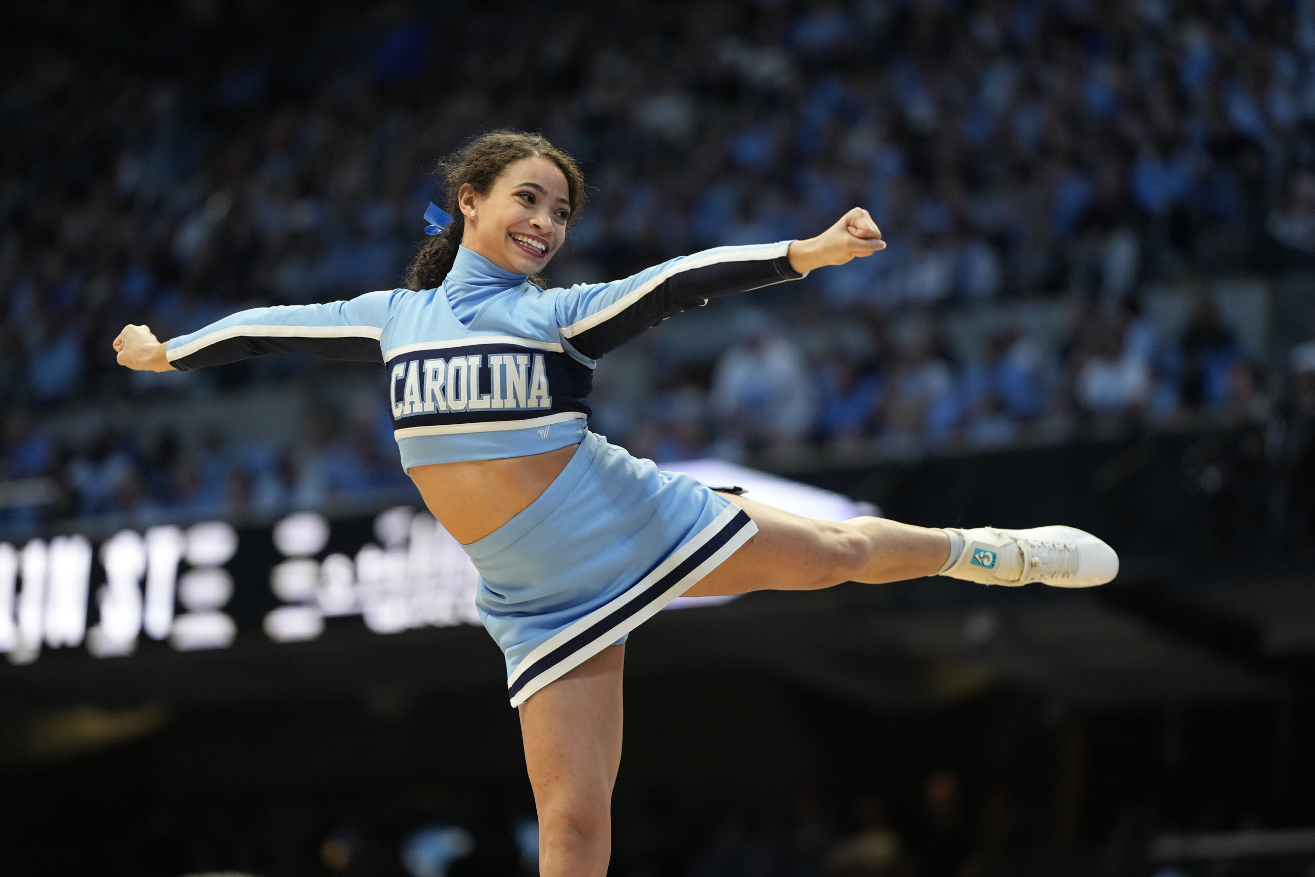 Feb 3, 2024; Chapel Hill, North Carolina, USA; North Carolina Tar Heels cheerleader performs in the second half at Dean E. Smith Center. Mandatory Credit: Bob Donnan-Imagn Images