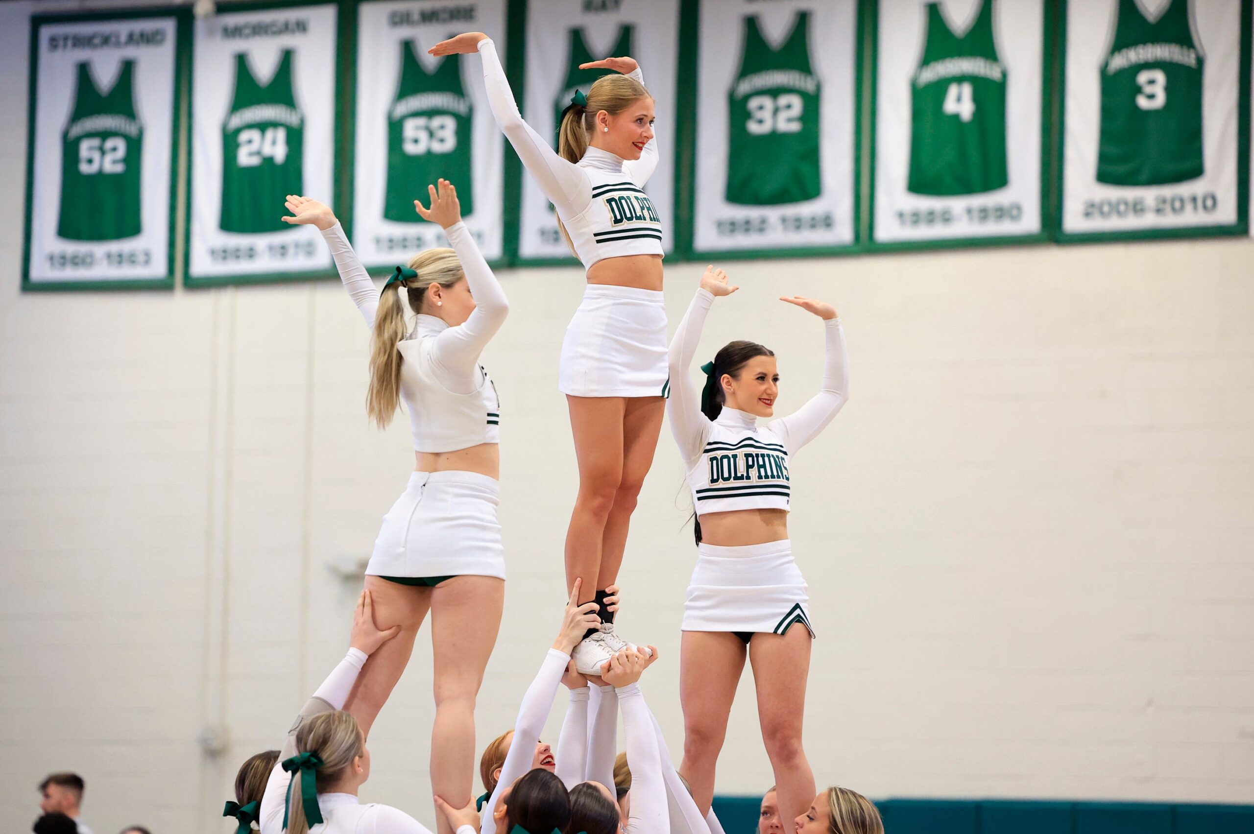 Jacksonville Dolphins cheerleaders perform during a time out during the third quarter of an NCAA women   s basketball matchup Saturday, Feb. 17, 2024 at Jacksonville University   s Swisher Gymnasium in Jacksonville, Fla. JU downed UNF 73-60.