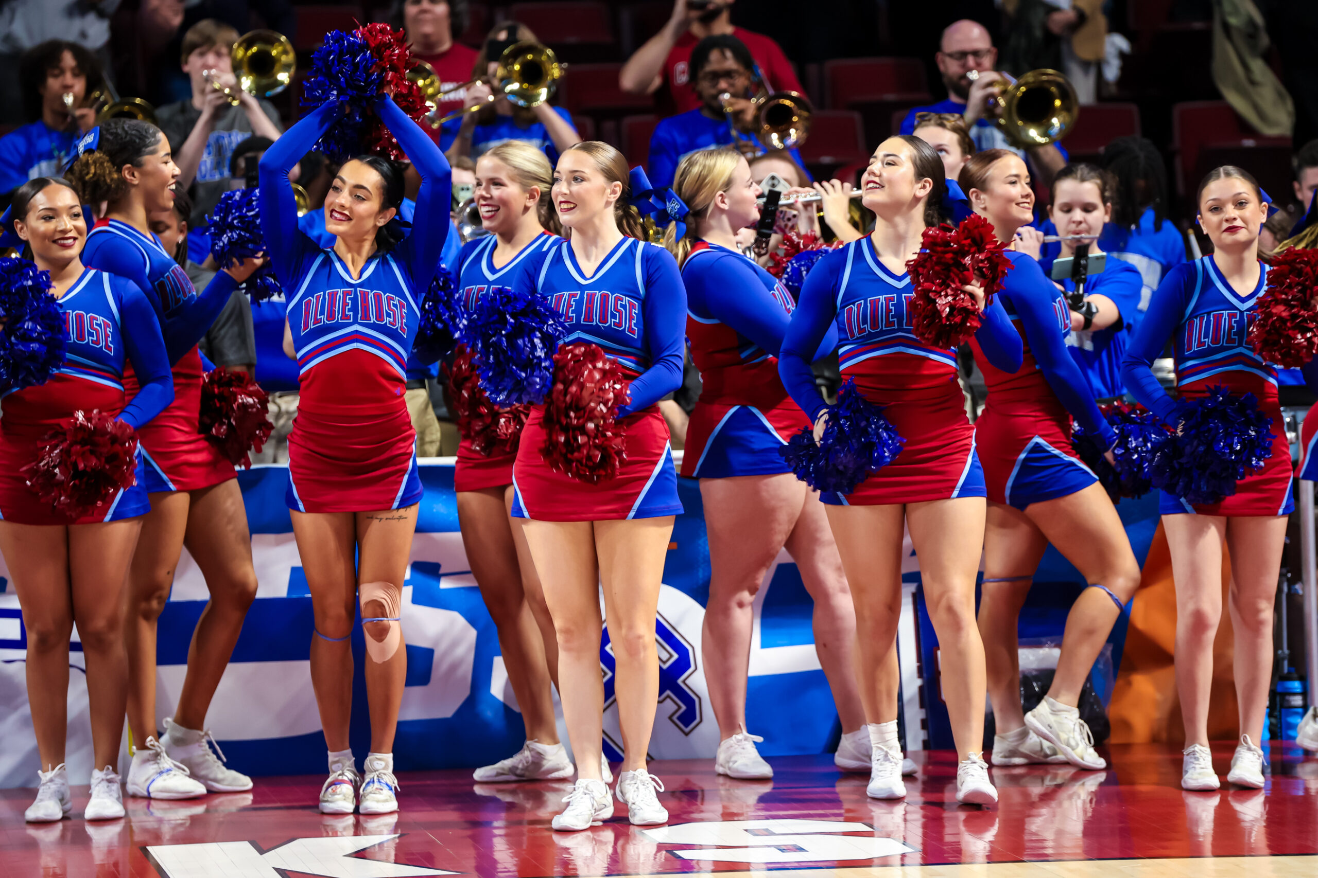 Mar 22, 2024; Columbia, SC, USA; Presbyterian Blue Hose cheerleaders cheer their team against the South Carolina Gamecocks in the second half at Colonial Life Arena. Mandatory Credit: Jeff Blake-Imagn Images