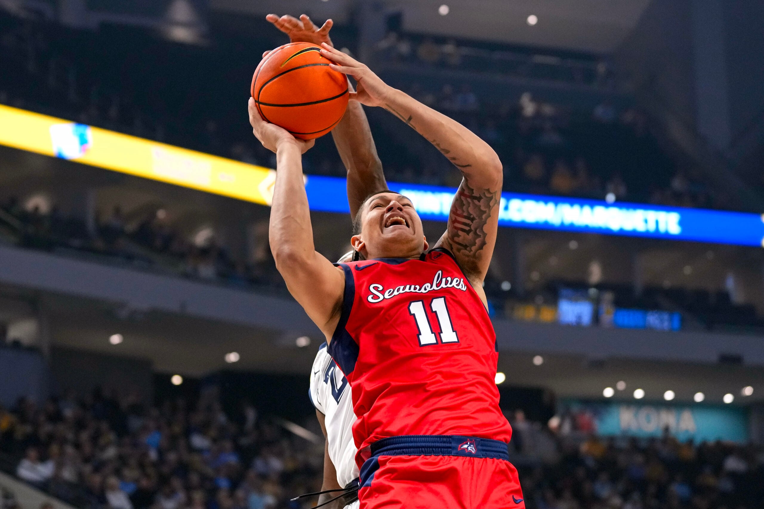 Nov 4, 2024; Milwaukee, Wisconsin, USA;  Stony Brook Seawolves guard-forward Nick Woodard (11) shoots during the first half against the Marquette Golden Eagles at Fiserv Forum. Mandatory Credit: Jeff Hanisch-Imagn Images