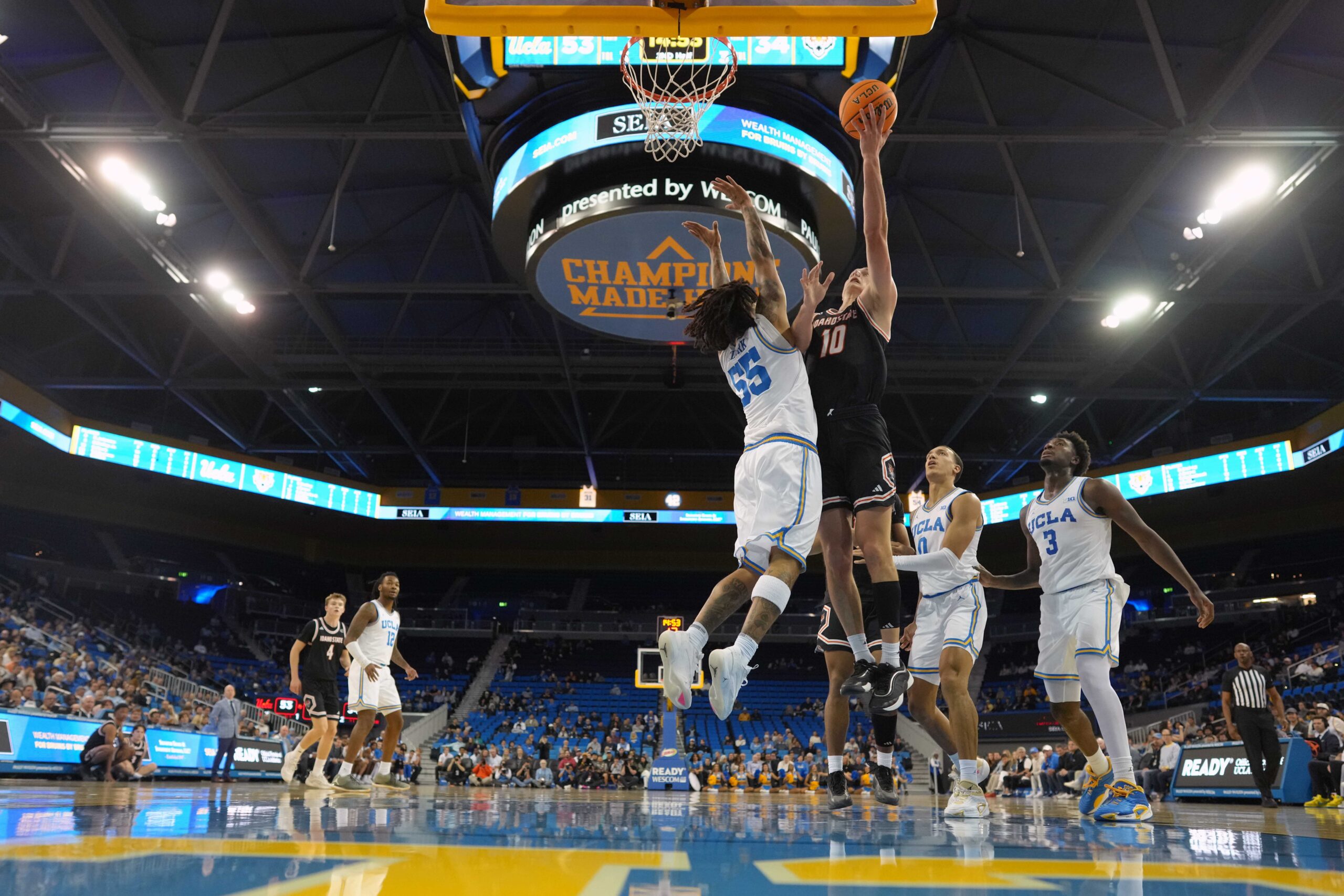Nov 20, 2024; Los Angeles, California, USA; Idaho State Bengals forward Connor Hollenbeck (10) shoots the ball against UCLA Bruins guard Skyy Clark (55) in the second half at Pauley Pavilion presented by Wescom. Mandatory Credit: Kirby Lee-Imagn Images
