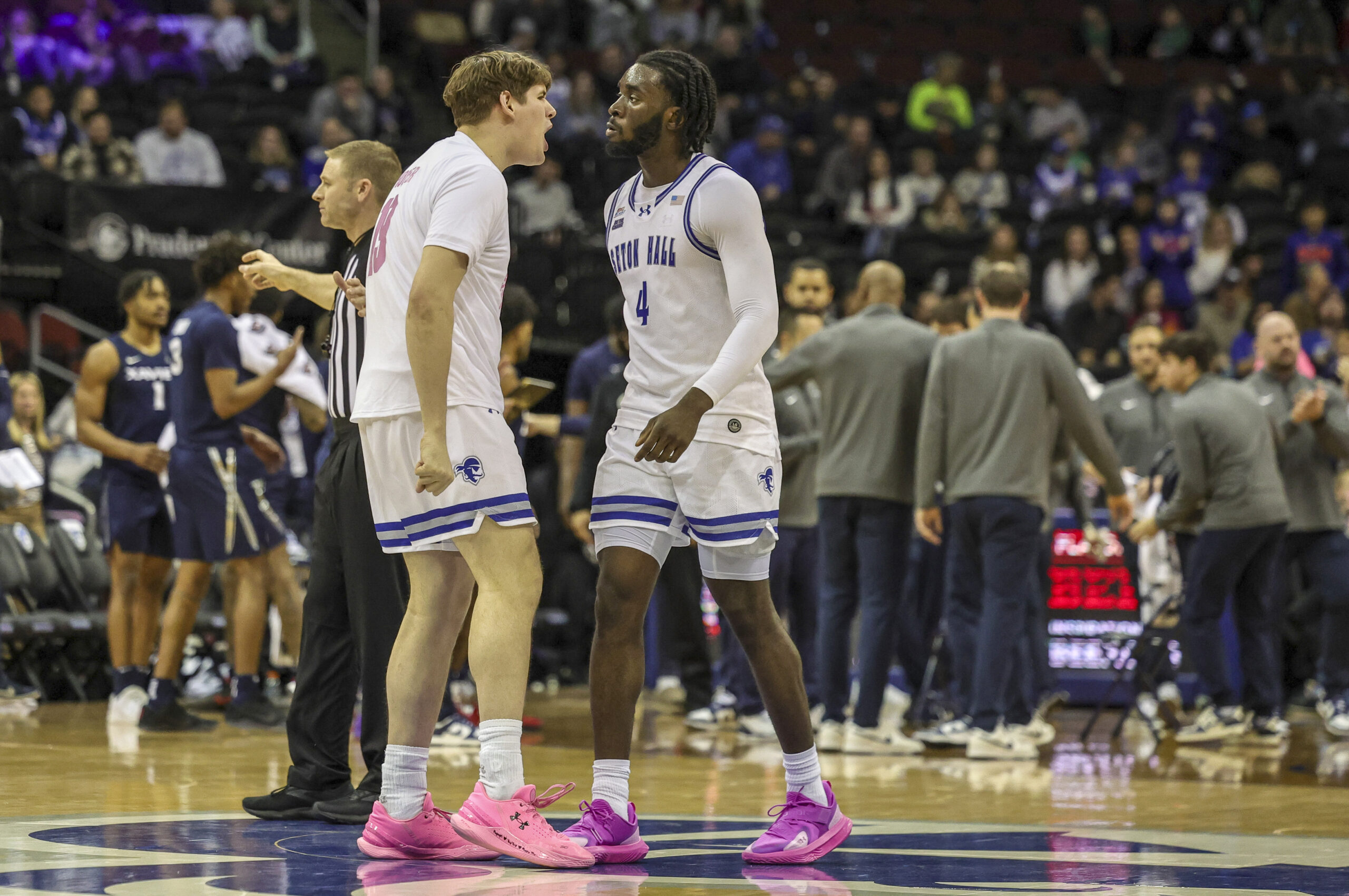 Feb 23, 2025; Newark, New Jersey, USA;  Seton Hall Pirates forward Gus Yalden (19) reacts to a play with forward Prince Aligbe (4) during a timeout against the Xavier Musketeers at Prudential Center. Mandatory Credit: Scott Rausenberger-Imagn Images