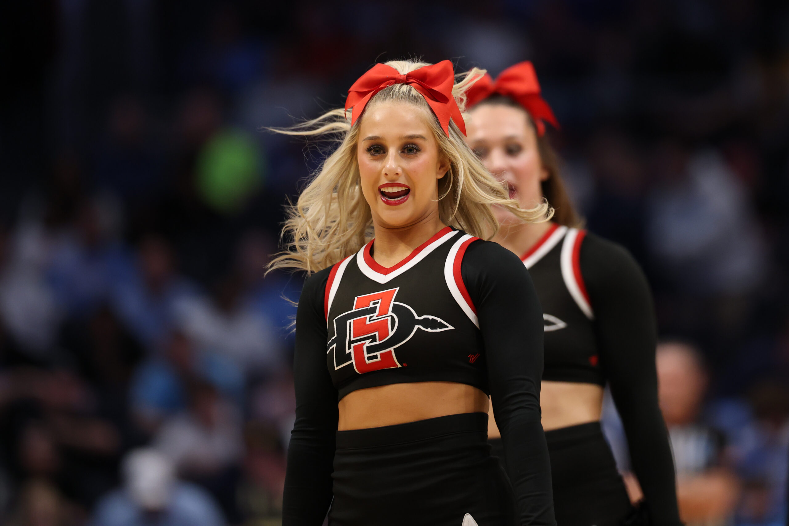 Mar 18, 2025; Dayton, OH, USA; San Diego State Aztecs cheerleaders perform in the first half against the North Carolina Tar Heels at UD Arena. Mandatory Credit: Rick Osentoski-Imagn Images