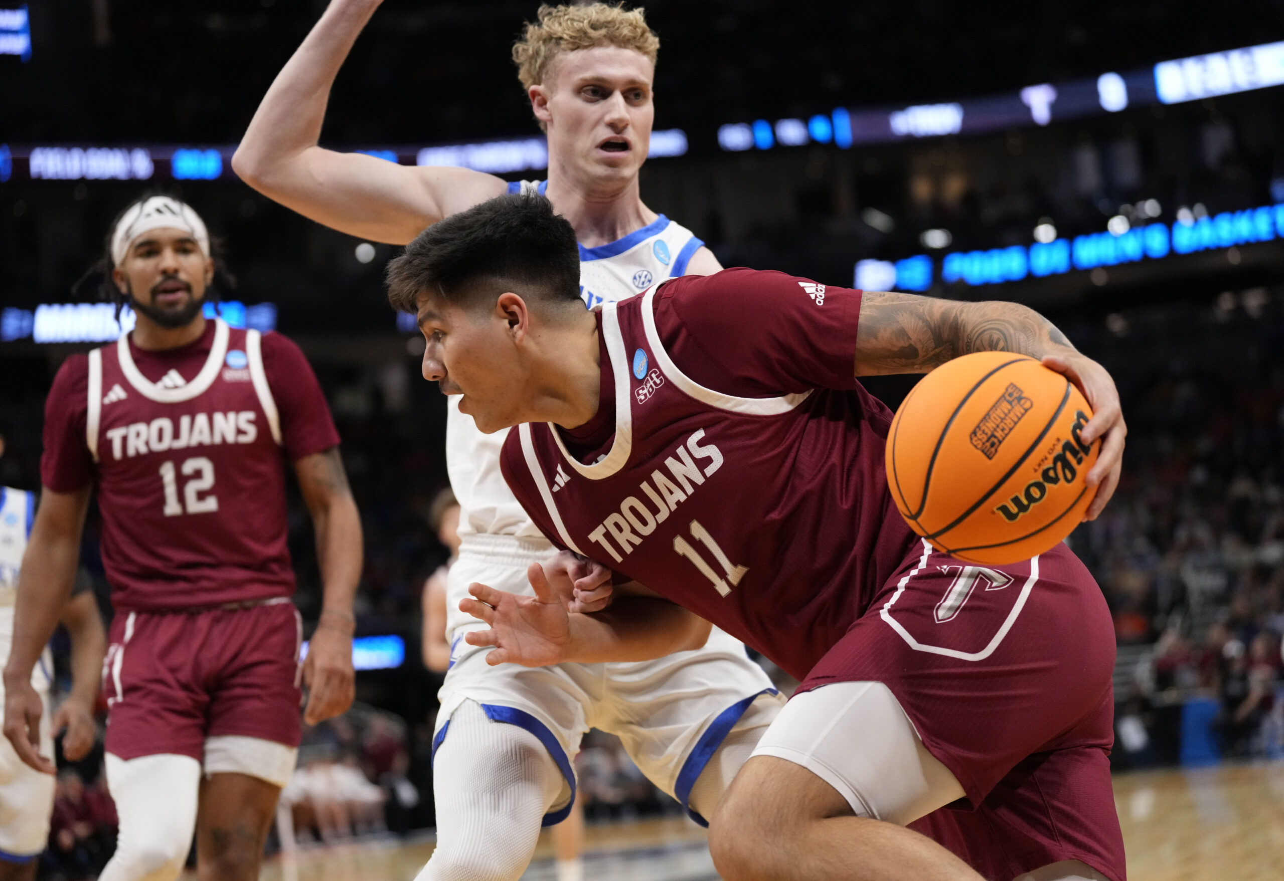 Mar 21, 2025; Milwaukee, WI, USA; Troy Trojans forward Victor Valdes (11) drives to the hoop past Kentucky Wildcats guard Collin Chandler (5) during the first half at Fiserv Forum. Mandatory Credit: Jeff Hanisch-Imagn Images