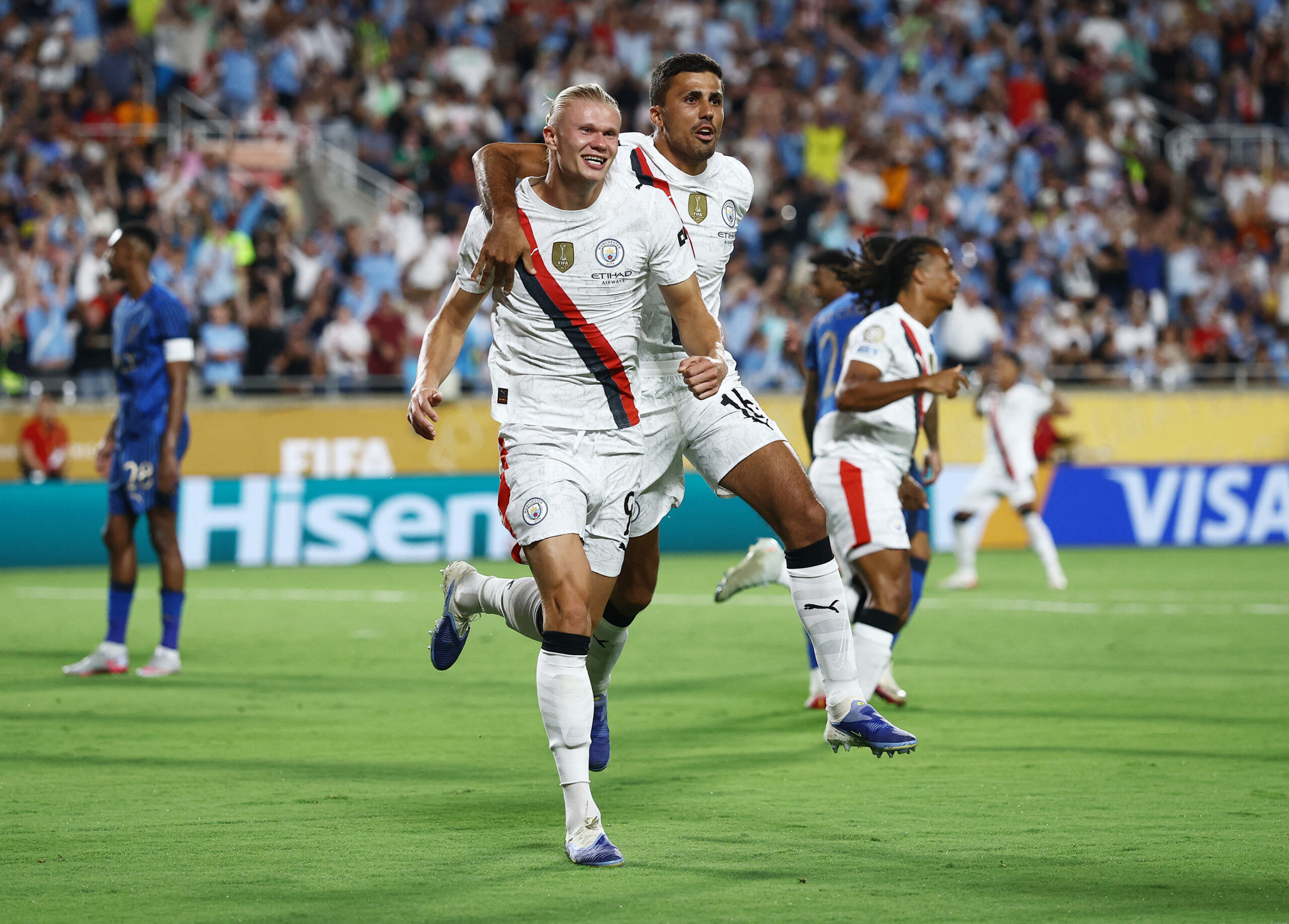 [Subscription Customers Only] Jun 30, 2025; Orlando, Florida, USA; Manchester City forward Erling Haaland (9) celebrates scoring their second goal with midfielder Rodri (16) during a round of 16 match of the 2025 FIFA Club World Cup at Camping World Stadium. Mandatory Credit: Lee Smith-Reuters via Imagn Images