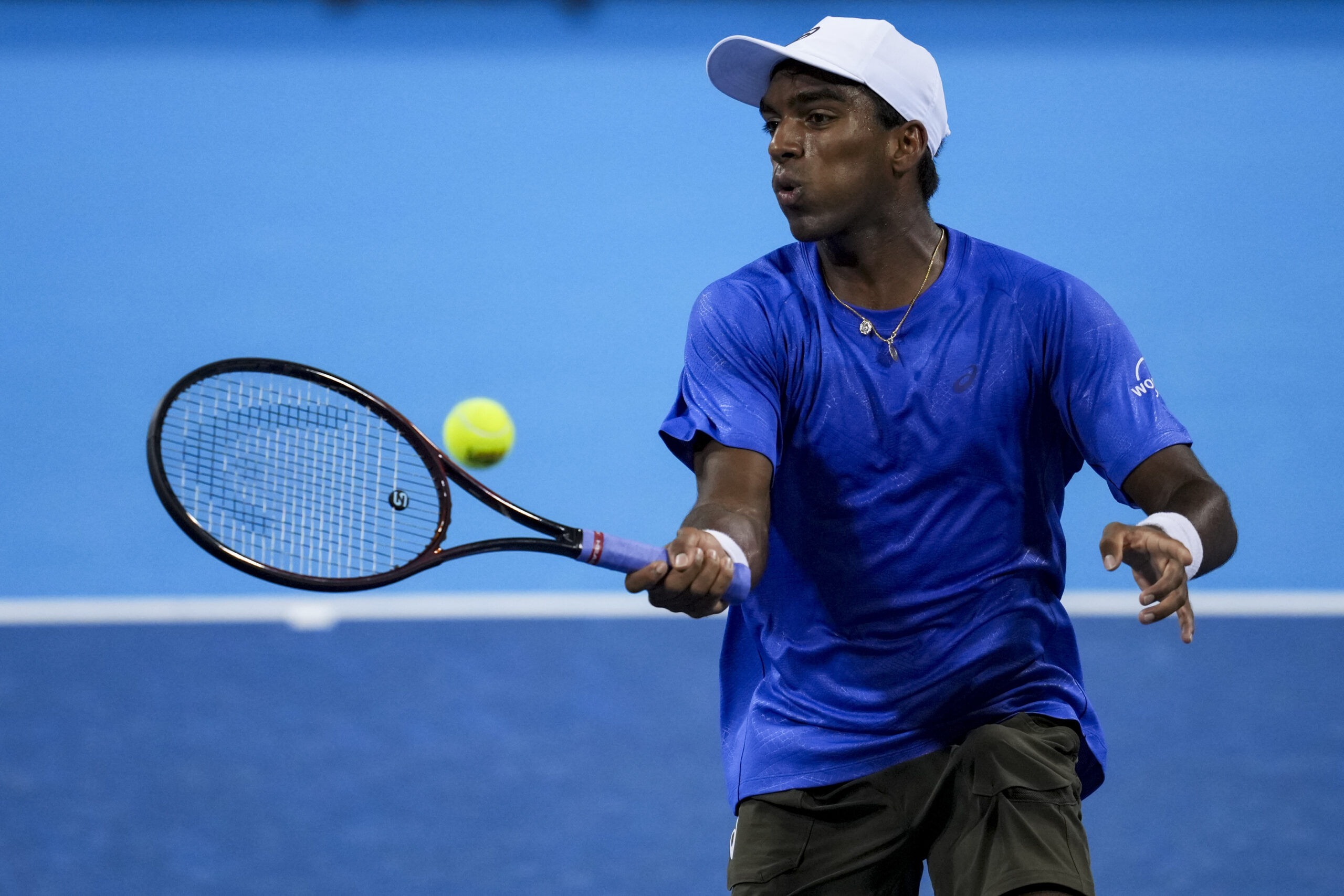 Aug 10, 2025; Cincinnati, OH, USA;  Nishesh Basavareddy (USA) returns a shot against Alexander Zverev (GER) during the Cincinnati Open at the Lindner Family Tennis Center. Mandatory Credit: Aaron Doster-Imagn Images