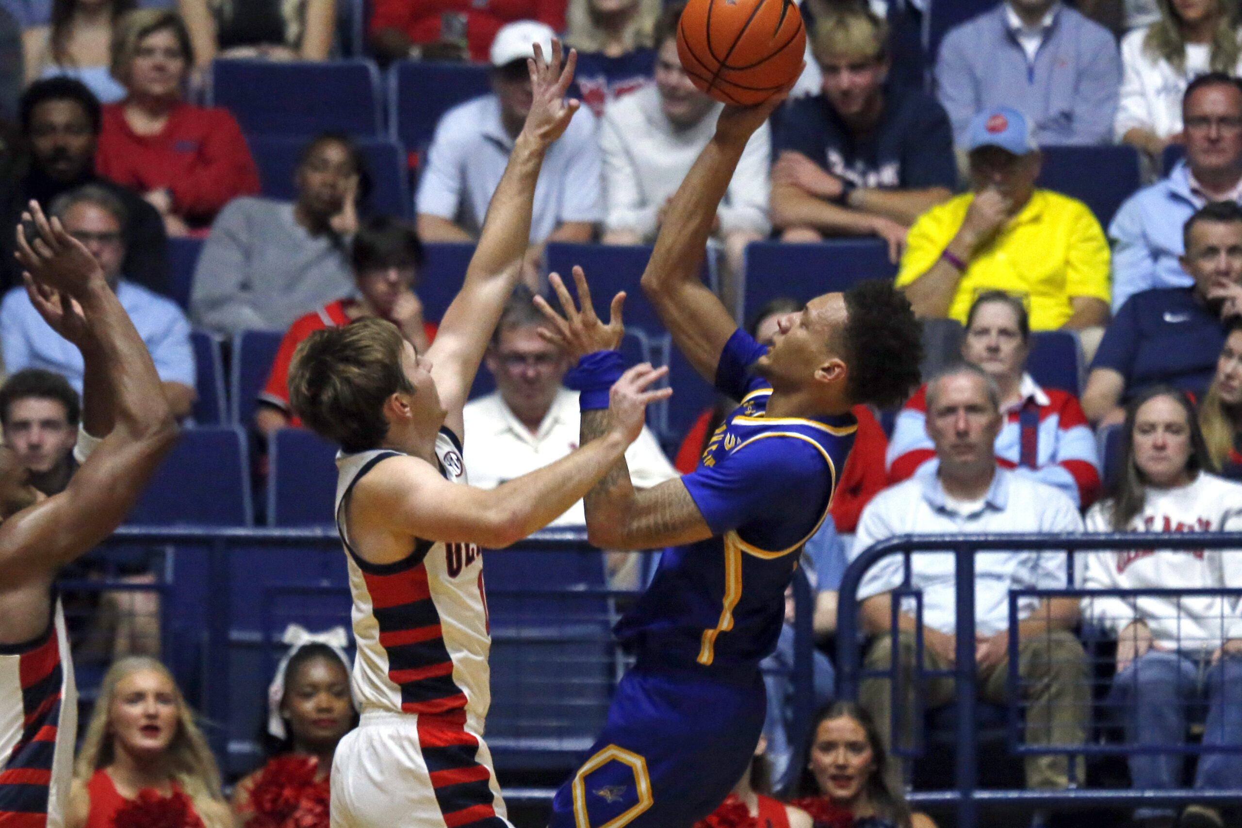 Nov 14, 2025; Oxford, Mississippi, USA; Cal State Bakersfield Roadrunners guard Dailin Smith (15) shoots as Mississippi Rebels guard Travis Perry (11) defends during the first half at C.M. ’Tad’ Smith Coliseum. Mandatory Credit: Petre Thomas-Imagn Images