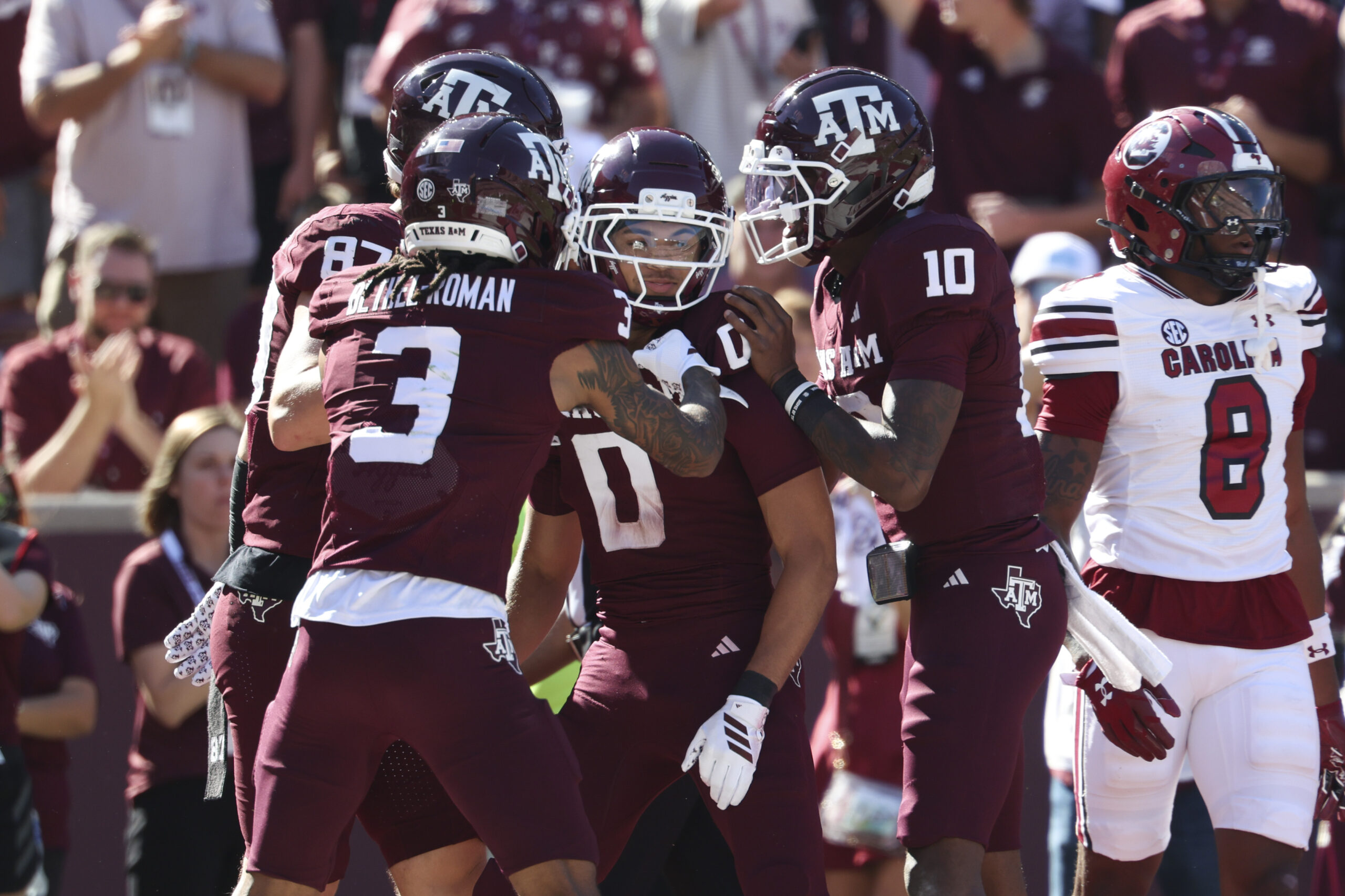 Nov 15, 2025; College Station, Texas, USA; Texas A&M Aggies wide receiver Izaiah Williams (0) celebrates with quarterback Marcel Reed (10) after scoringa a touchdown during the third quarter against the South Carolina Gamecocks at Kyle Field. Mandatory Credit: Troy Taormina-Imagn Images
