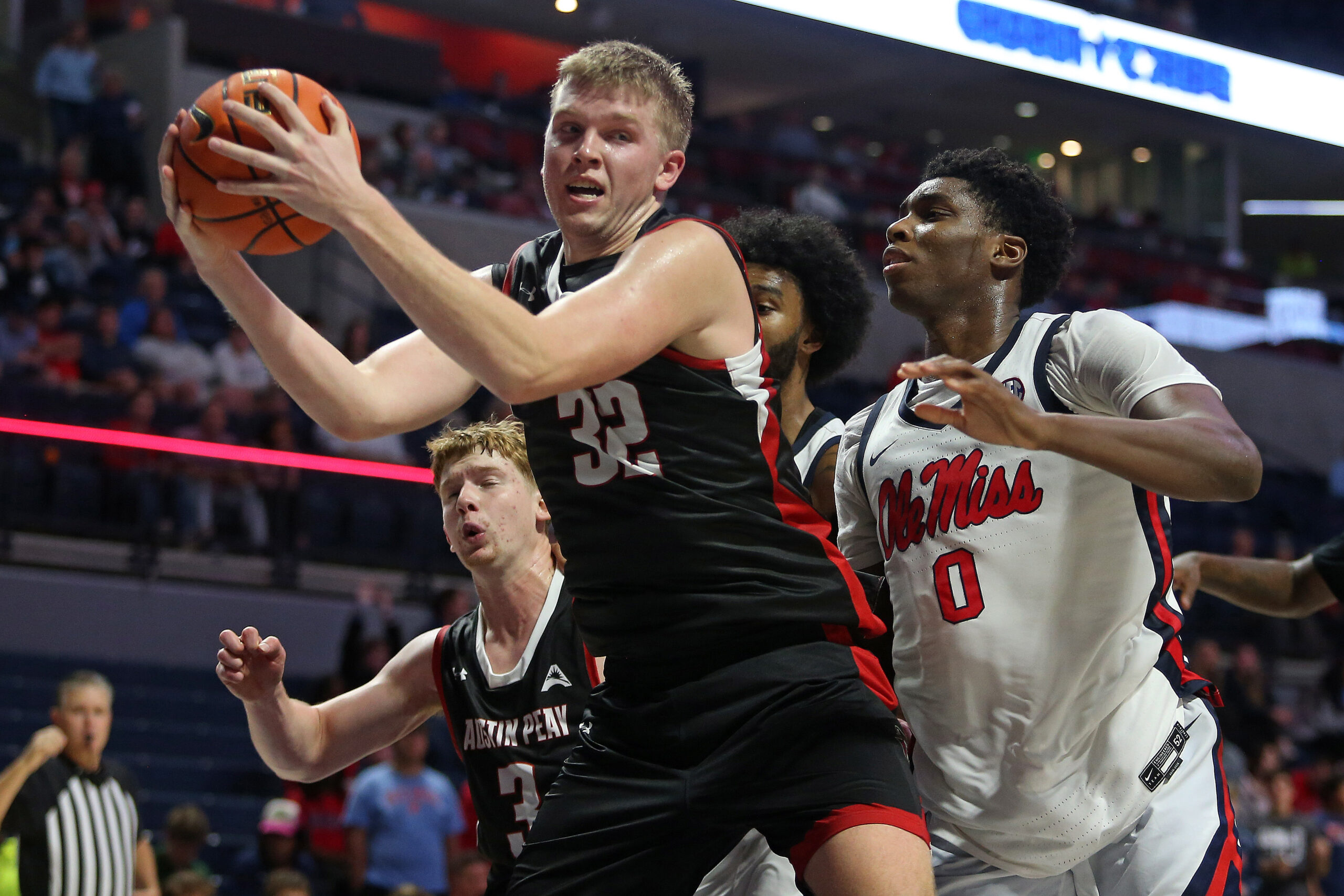 Nov 18, 2025; Oxford, Mississippi, USA; Austin Peay Governors forward Collin Parker (32) collects a rebound during the second half against the Mississippi Rebels at The Sandy and John Black Pavilion at Ole Miss. Mandatory Credit: Petre Thomas-Imagn Images