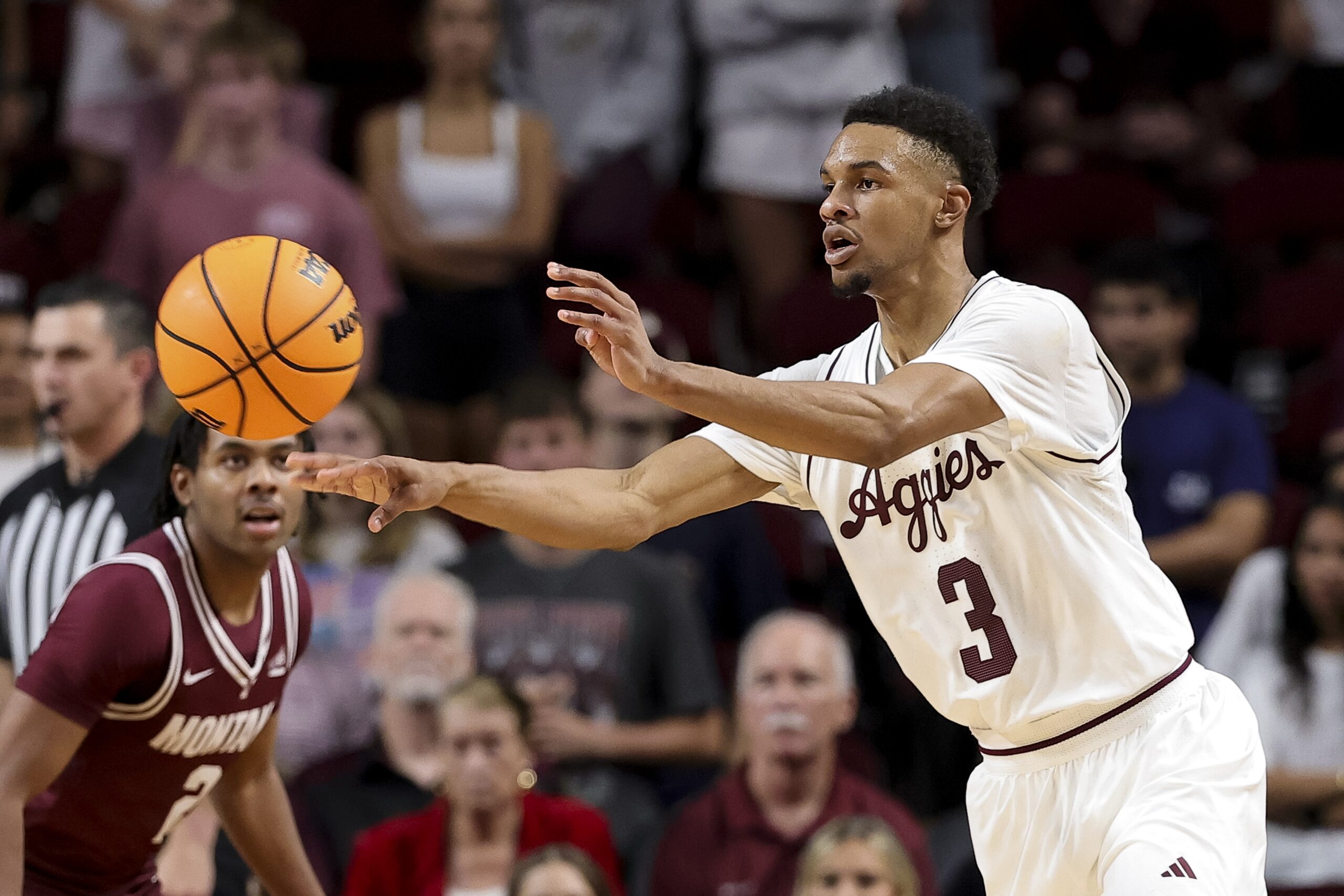 Nov 18, 2025; College Station, Texas, USA; Texas A&M Aggies guard Rylan Griffen (3) passes the ball against the Montana Grizzlies during the second half at Reed Arena. Mandatory Credit: Maria Lysaker-Imagn Images