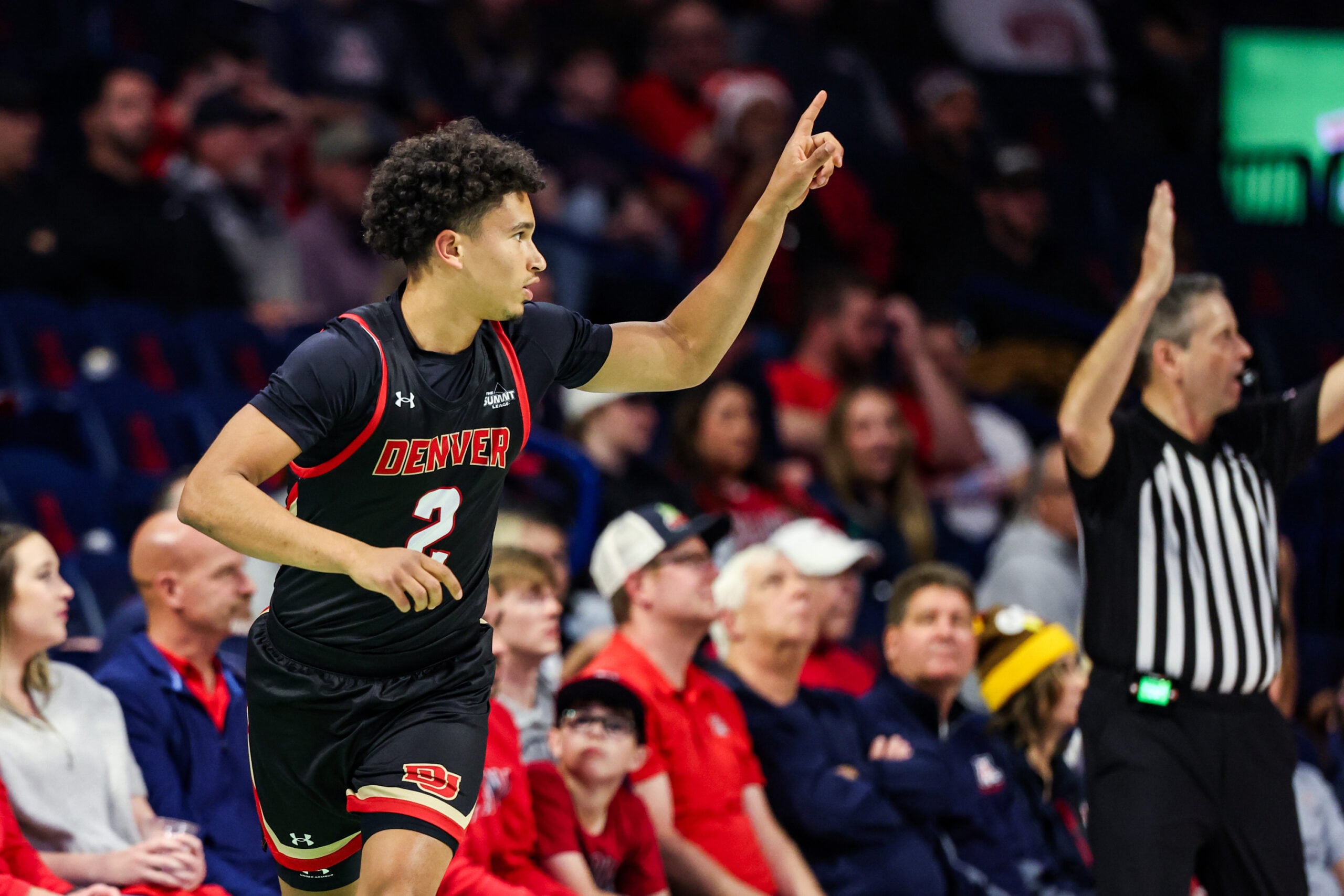 Nov 24, 2025; Tucson, Arizona, USA; Denver Pioneers guard Devin Carney (2) points up after he makes a three pointer during the second half of the game against the Arizona Wildcats at McKale Memorial Center. Mandatory Credit: Aryanna Frank-Imagn Images