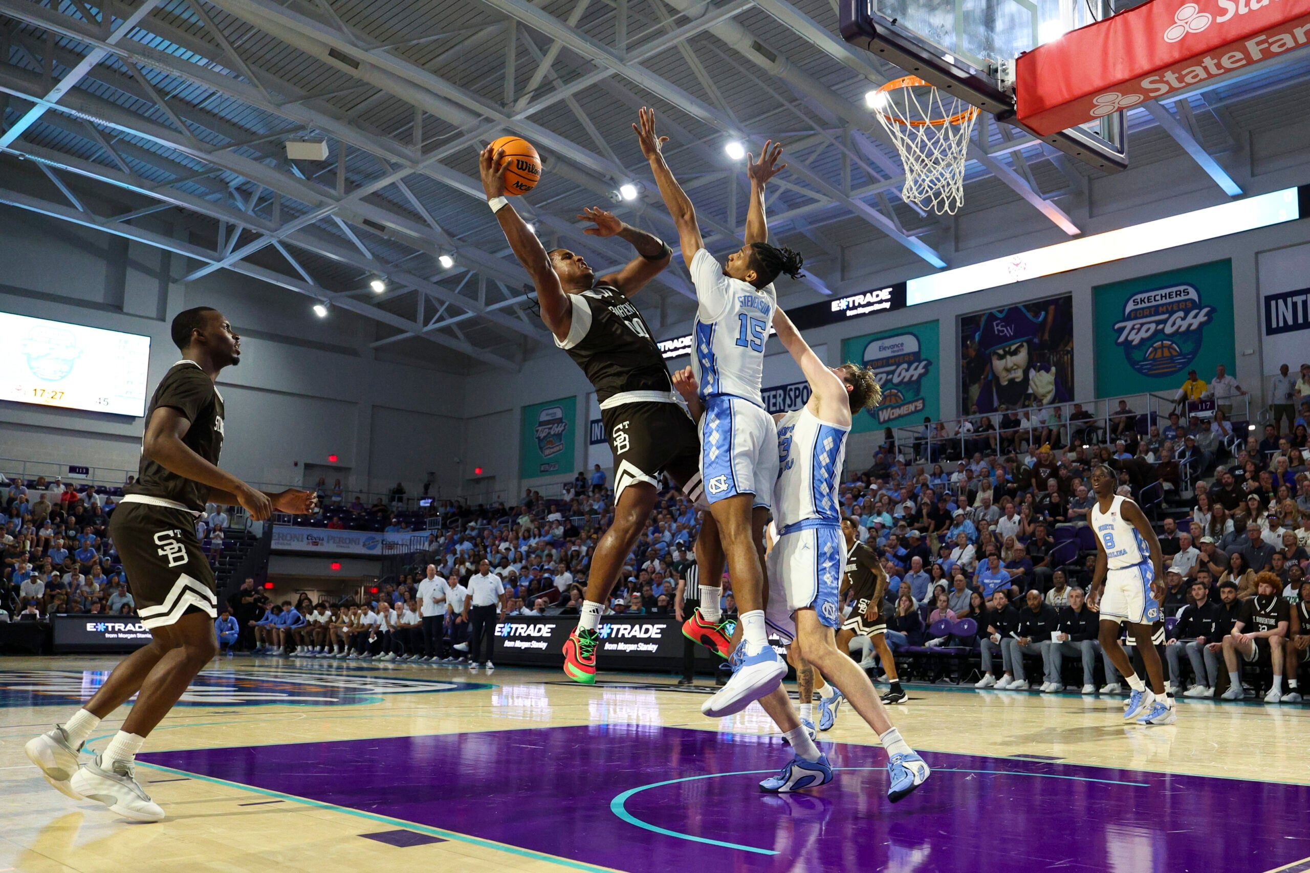 Nov 25, 2025; Fort Myers, Florida, USA; St. Bonaventure Bonnies forward Frank Mitchell (00) shoots the ball over North Carolina Tar Heels forward Jarin Stevenson (15) in the second half at Suncoast Credit Union Arena. Mandatory Credit: Nathan Ray Seebeck-Imagn Images
