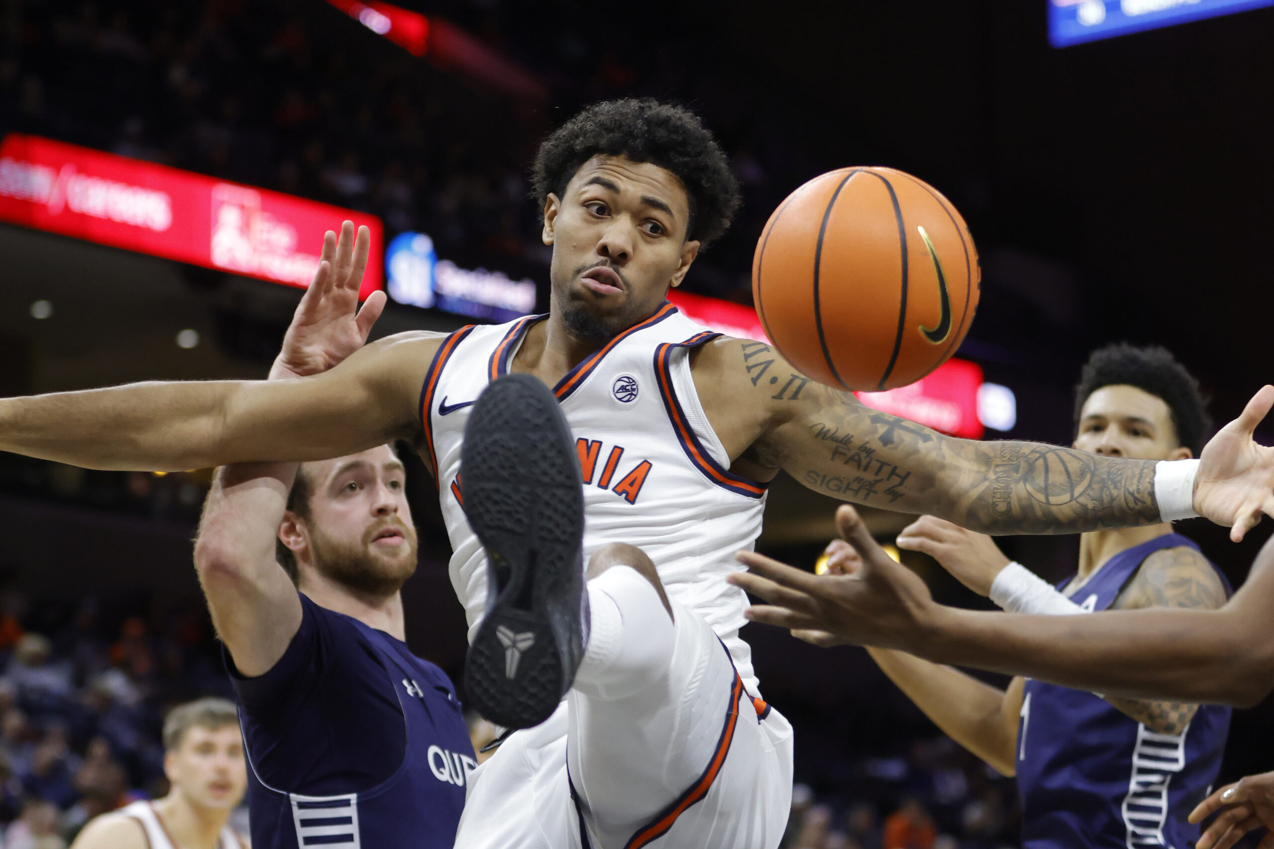 Nov 28, 2025; Charlottesville, Virginia, USA; Virginia Cavaliers guard Malik Thomas (1) battles for the ball against the Queens University of Charlotte Royals during the second half at John Paul Jones Arena. Mandatory Credit: Amber Searls-Imagn Images