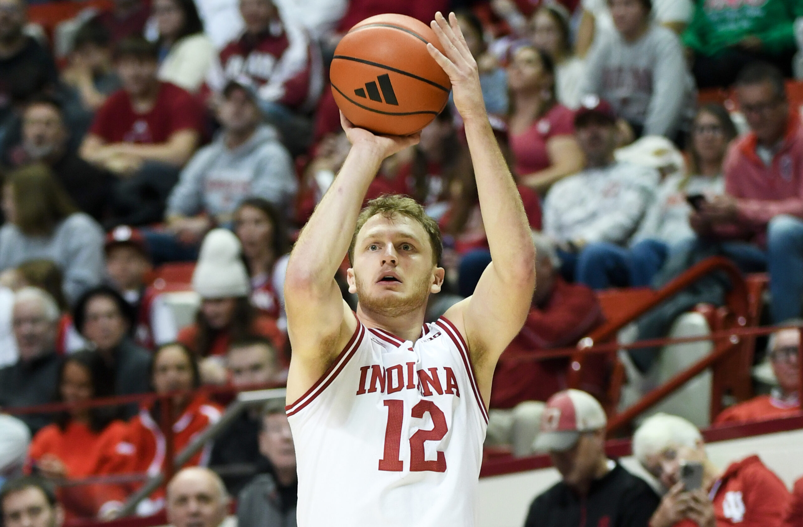 Nov 29, 2025; Bloomington, Indiana, USA; Indiana Hoosiers forward Tucker Devries (12) shoots the ball during the first half against the Bethune-Cookman Wildcats at Simon Skjodt Assembly Hall. Mandatory Credit: Robert Goddin-Imagn Images