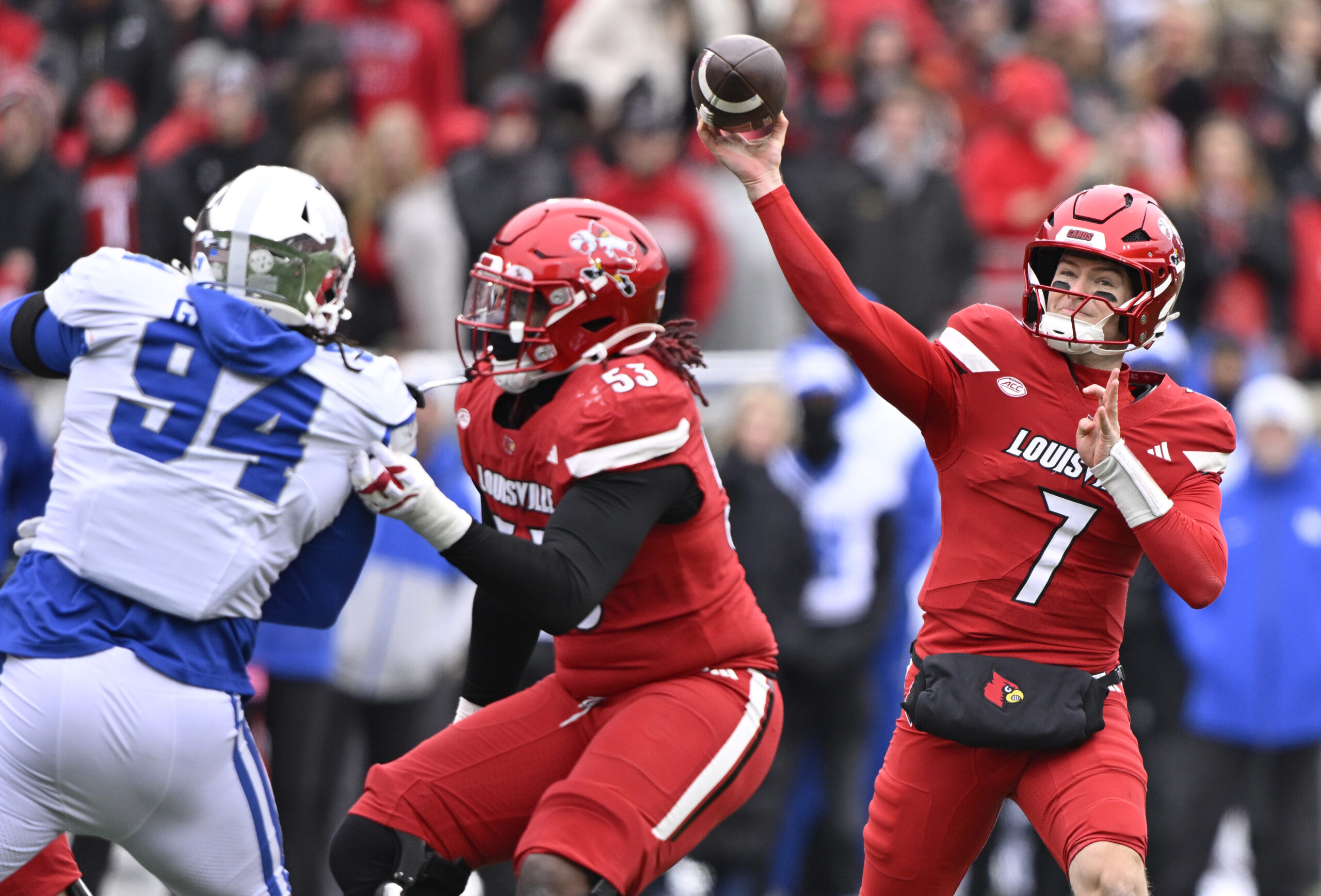 Nov 29, 2025; Louisville, Kentucky, USA;  Louisville Cardinals quarterback Miller Moss (7) attempts to pass against the Kentucky Wildcats during the first half at L&N Federal Credit Union Stadium. Louisville defeated Kentucky 41-0. Mandatory Credit: Jamie Rhodes-Imagn Images