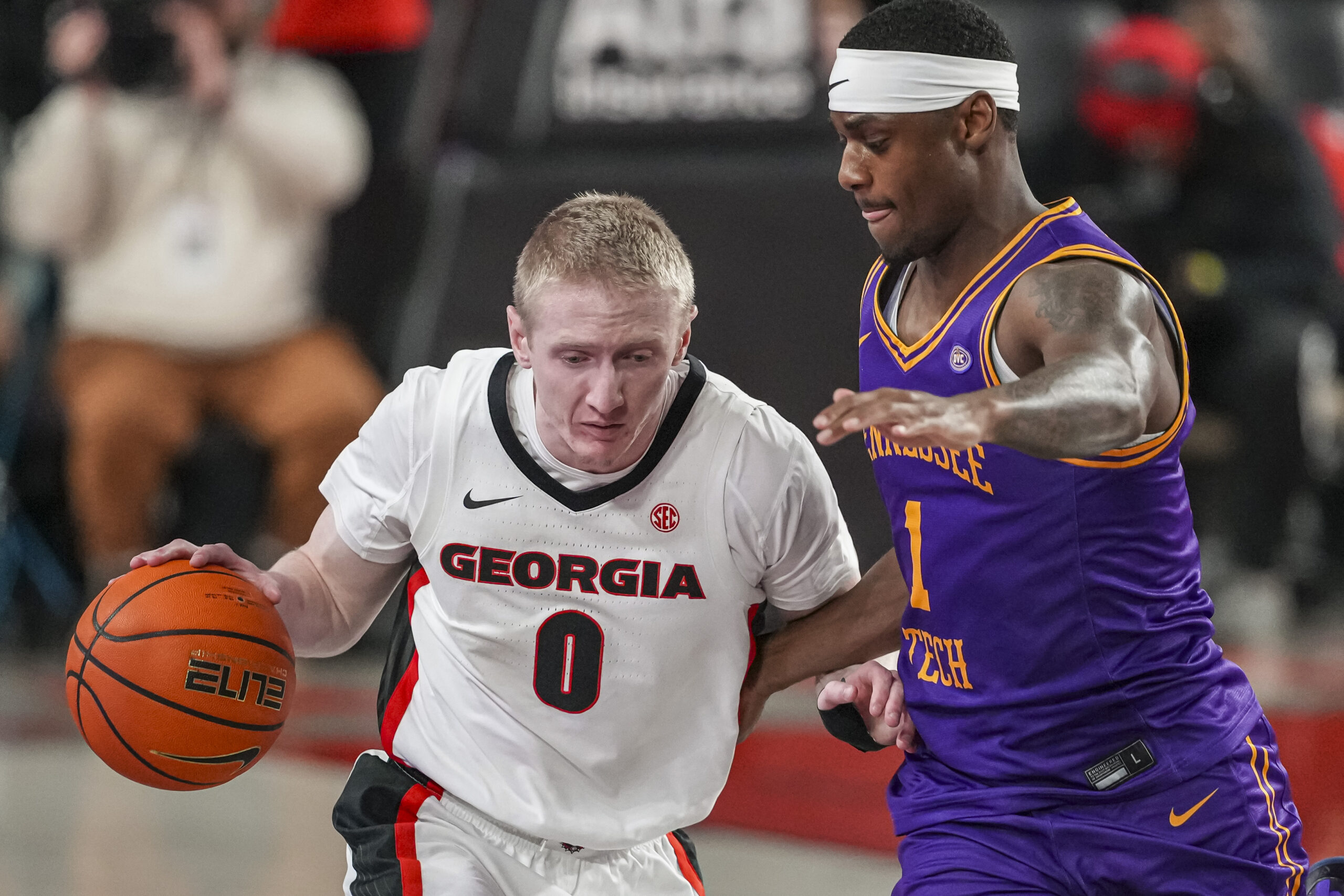 Nov 29, 2025; Athens, Georgia, USA; Georgia Bulldogs guard Blue Cain (0) dribbles against Tennessee Tech Golden Eagles guard Mekhi Cameron (1) during the second half at Stegeman Coliseum. Mandatory Credit: Dale Zanine-Imagn Images