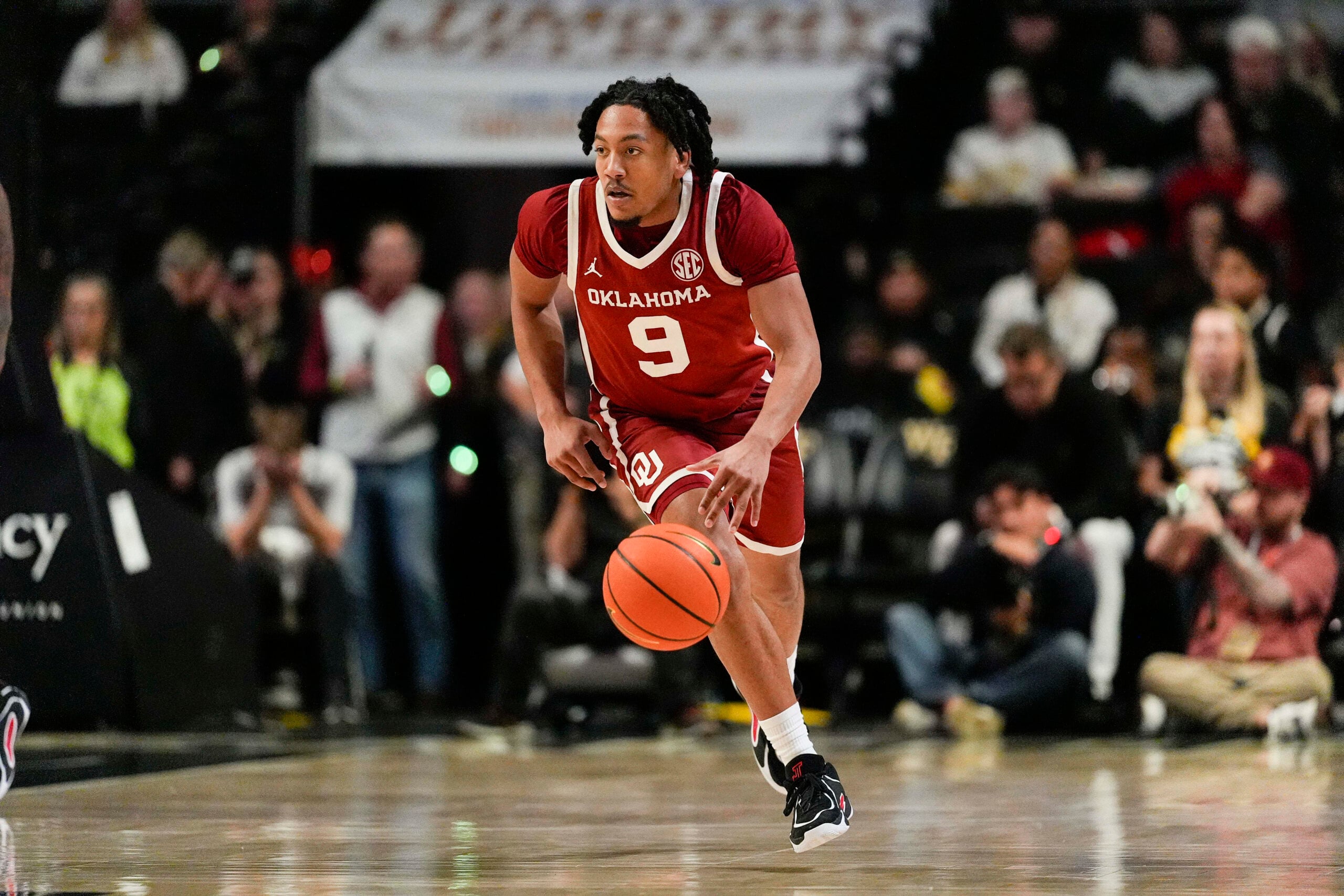Dec 2, 2025; Winston-Salem, North Carolina, USA; Oklahoma Sooners guard Nijel Pack (9) brings the ball up court against the Wake Forest Demon Deacons during the second half at Lawrence Joel Veterans Memorial Coliseum. Mandatory Credit: Jim Dedmon-Imagn Images