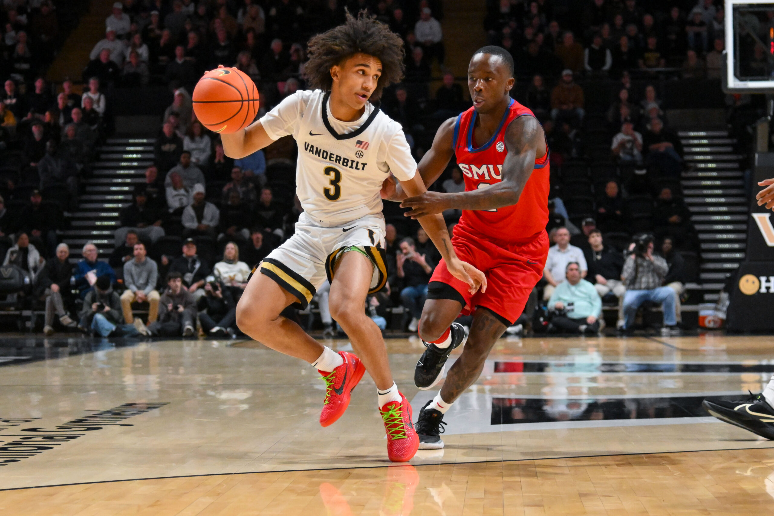 Dec 3, 2025; Nashville, Tennessee, USA;  Vanderbilt Commodores guard Tyler Tanner (3) dribbles past Southern Methodist University Mustangs guard Boopie Miller (2) during the first half at Memorial Gymnasium. Mandatory Credit: Steve Roberts-Imagn Images